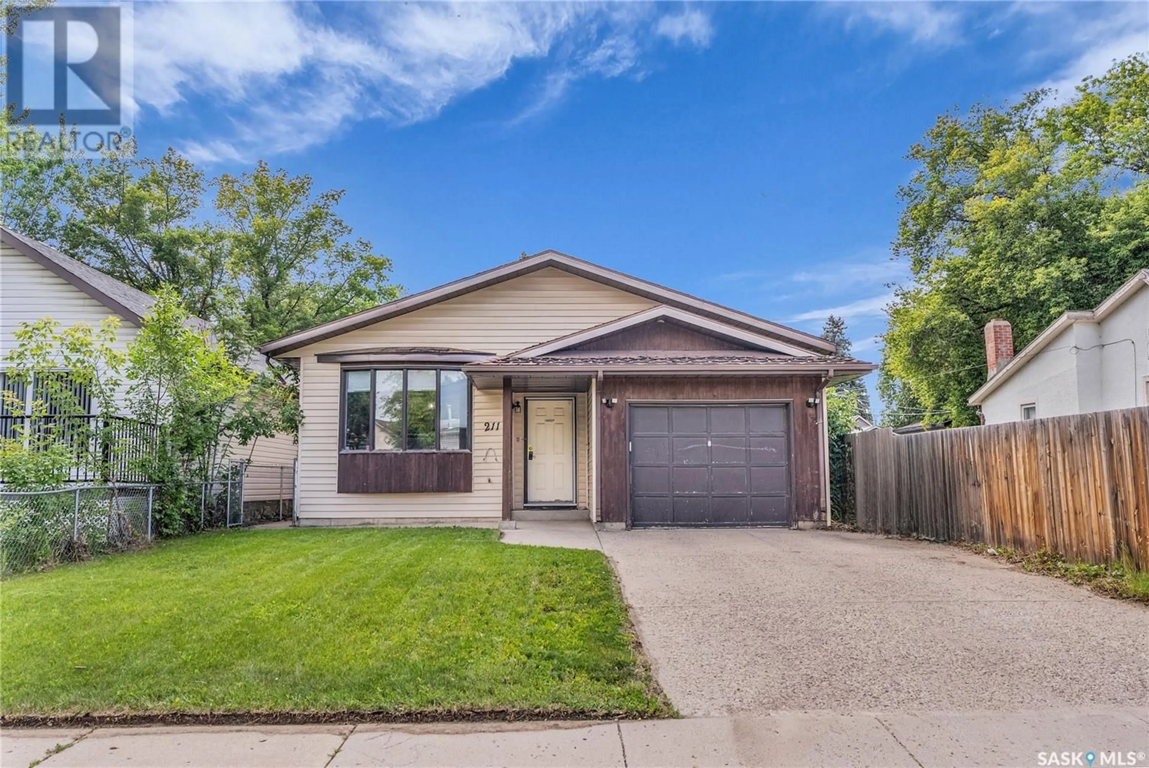 Home with brick exterior material, street for 211 L AVENUE, Saskatoon Saskatchewan S7L2P3