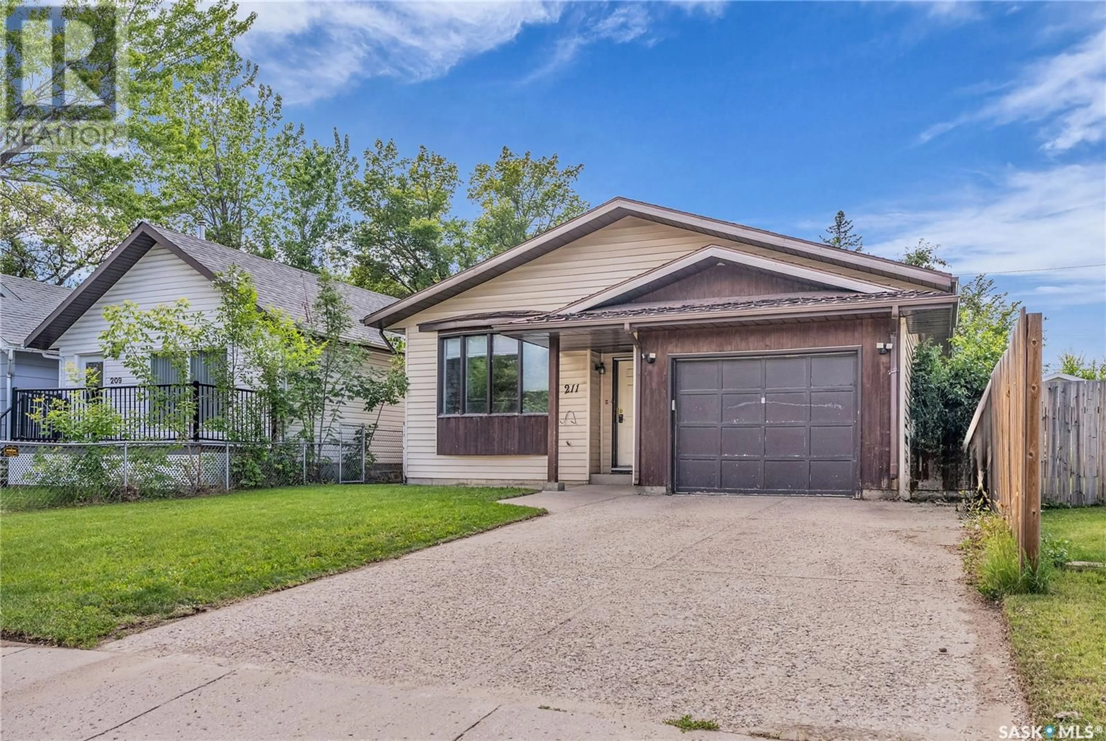 Home with brick exterior material, street for 211 L AVENUE, Saskatoon Saskatchewan S7L2P3