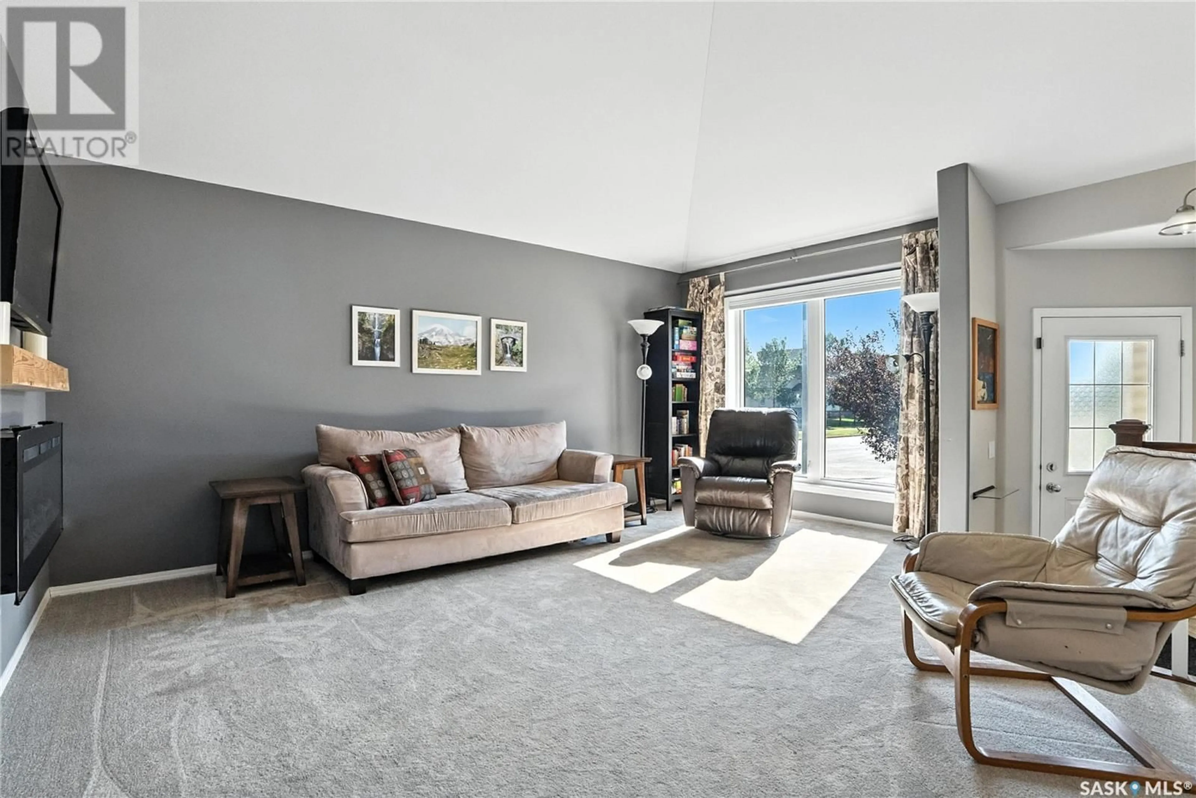Living room with furniture, unknown for 103 DULMAGE CRESCENT, Saskatoon Saskatchewan S7T0C7