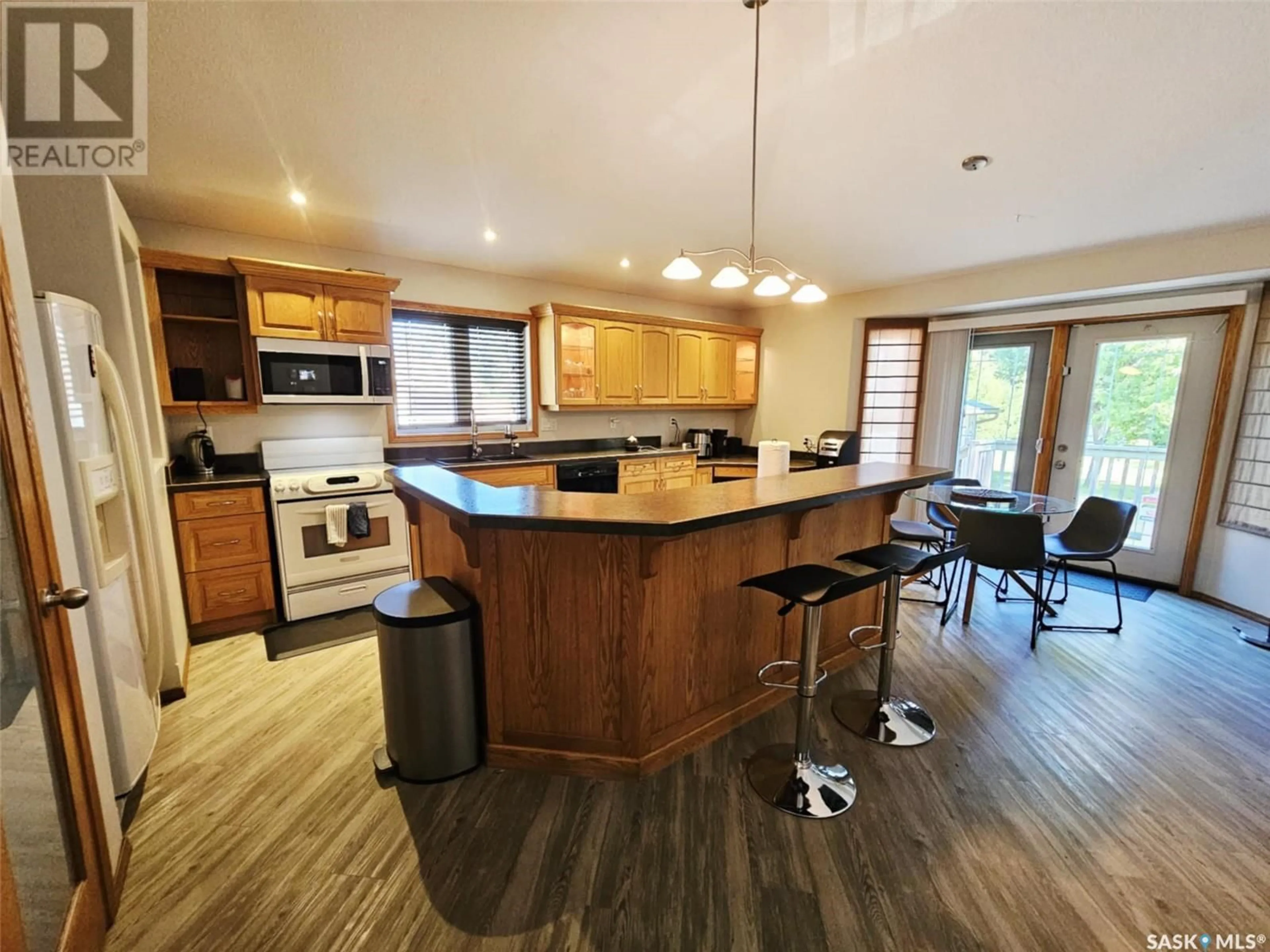 Open concept kitchen, wood/laminate floor for 1122 BORDEN DRIVE, Esterhazy Saskatchewan S0A0X0