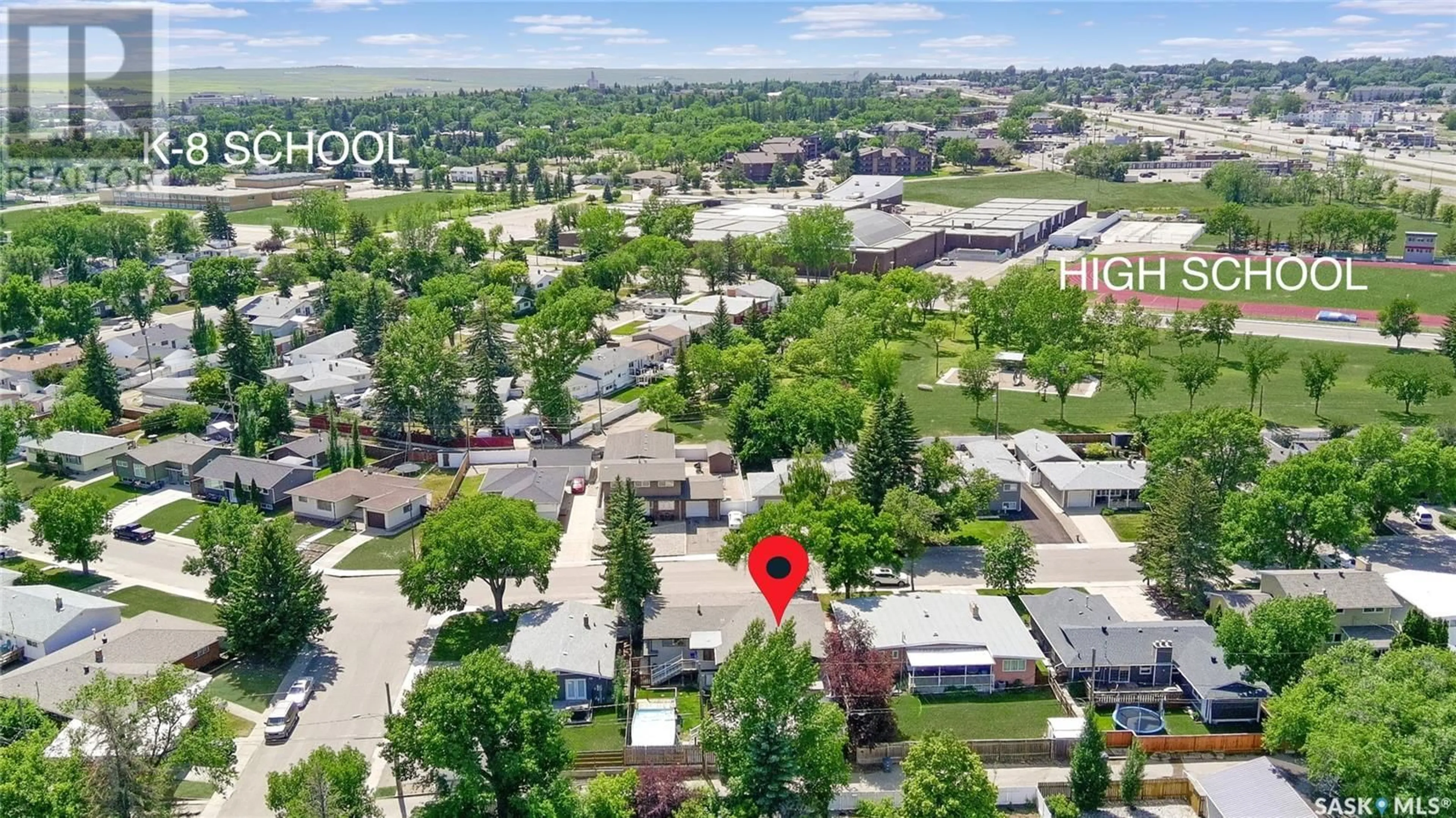 A pic from outside/outdoor area/front of a property/back of a property/a pic from drone, street for 1311 JUBILEE DRIVE, Swift Current Saskatchewan S9H2A5