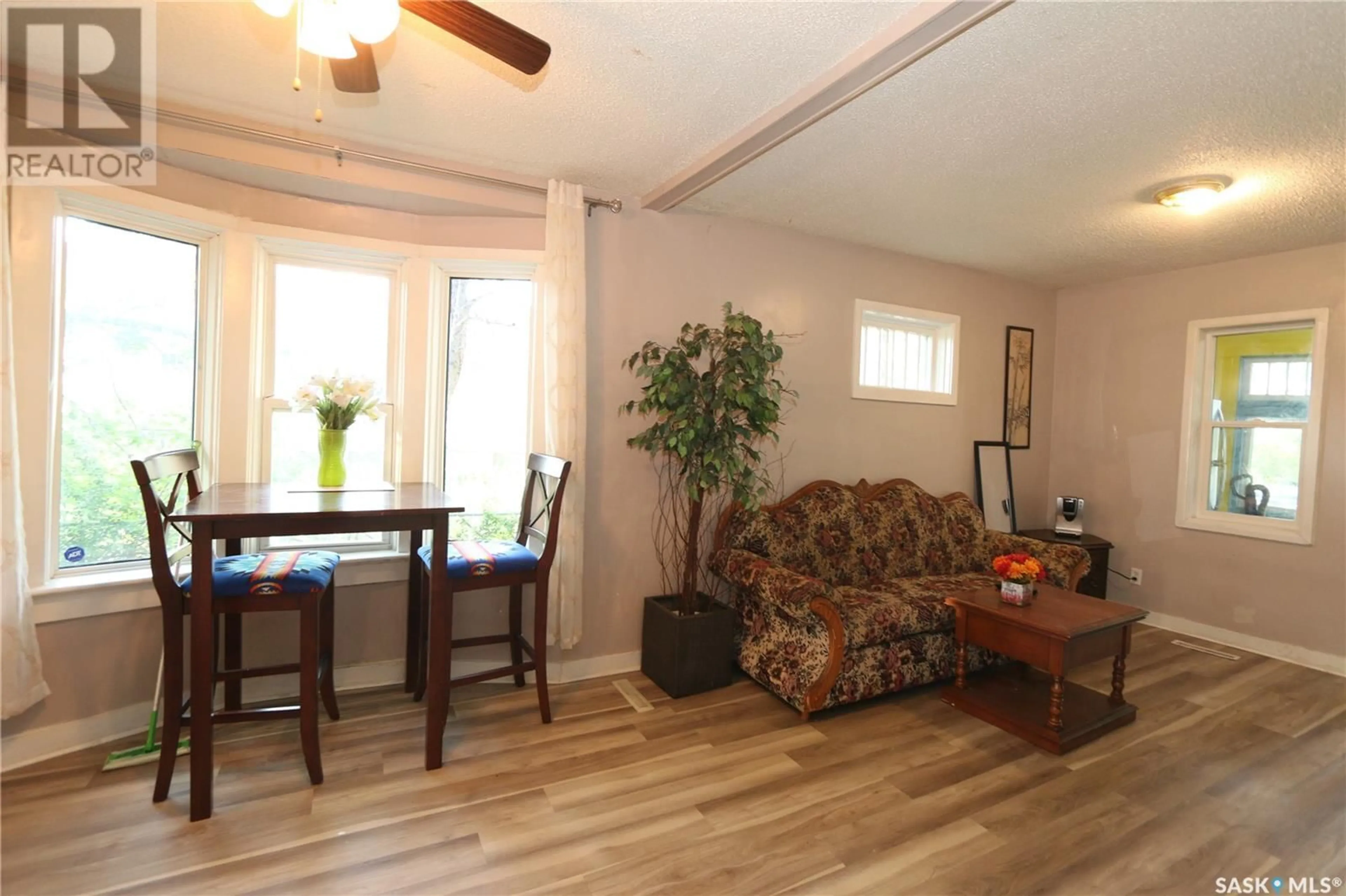 Living room with furniture, wood/laminate floor for 1360 ATHOL STREET, Regina Saskatchewan S4T3C5