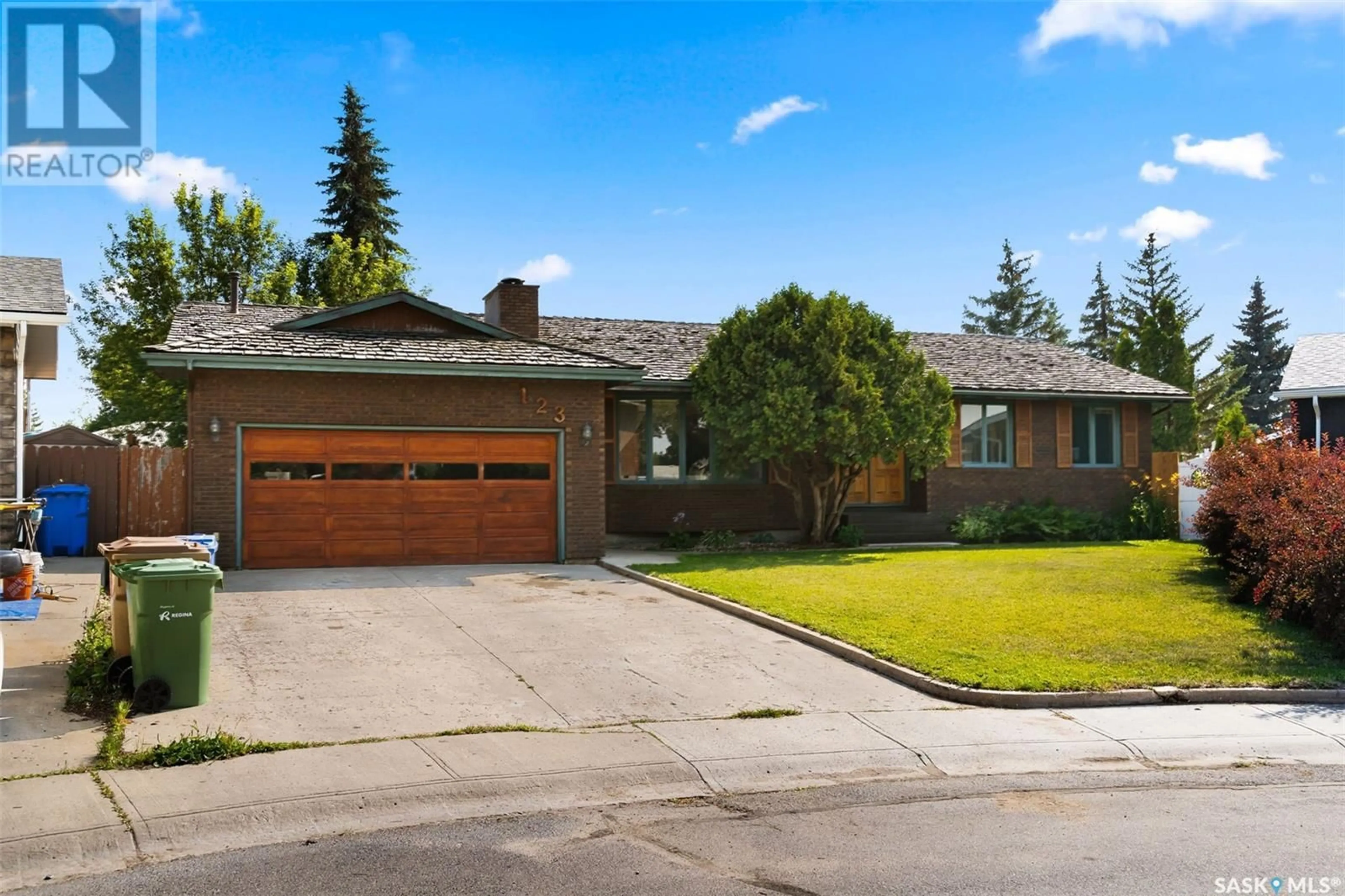 Home with brick exterior material, street for 123 DUNSMORE DRIVE, Regina Saskatchewan S4R7G3