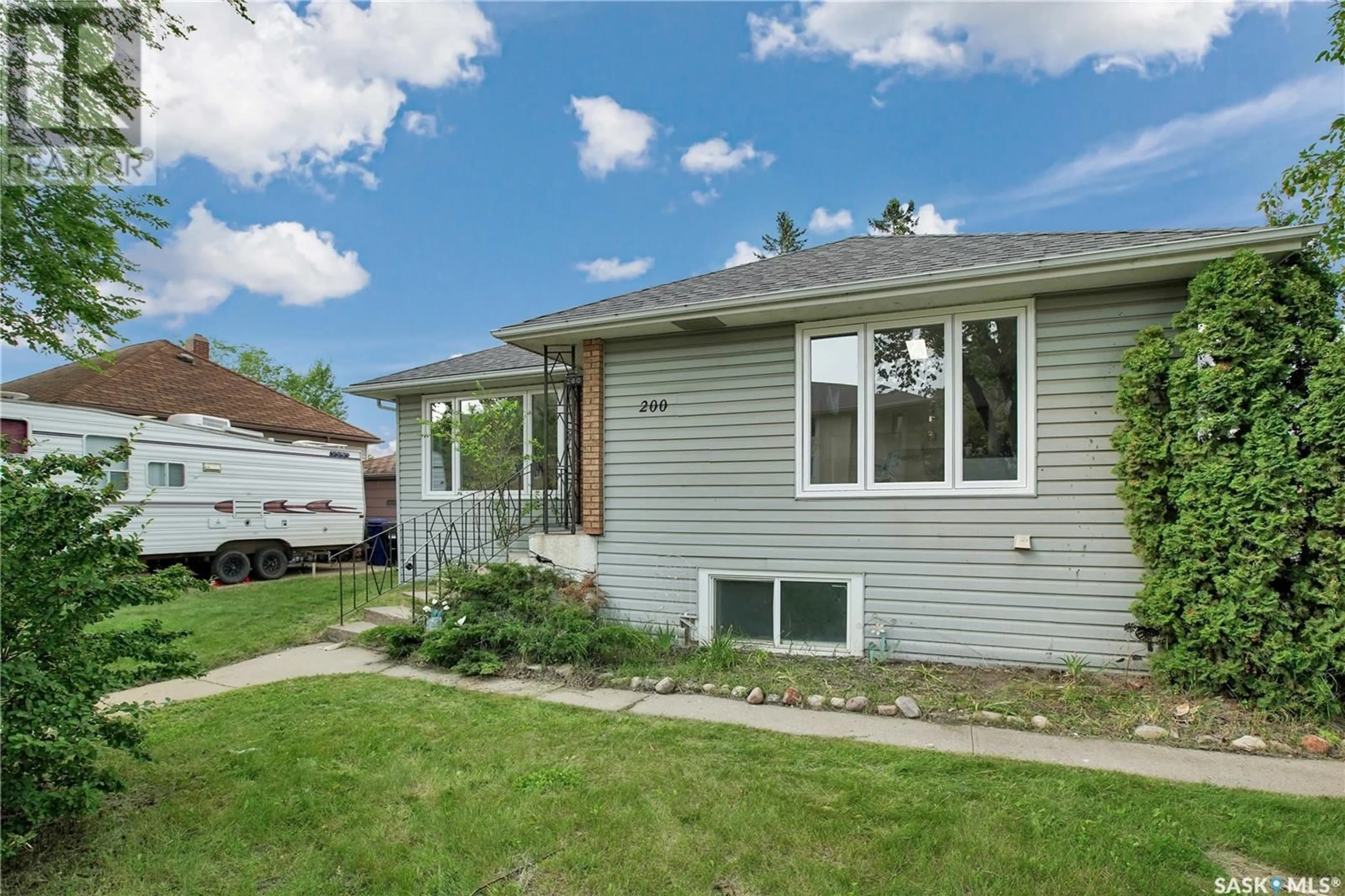 Home with vinyl exterior material, street for 200 108TH STREET, Saskatoon Saskatchewan S7N1P6