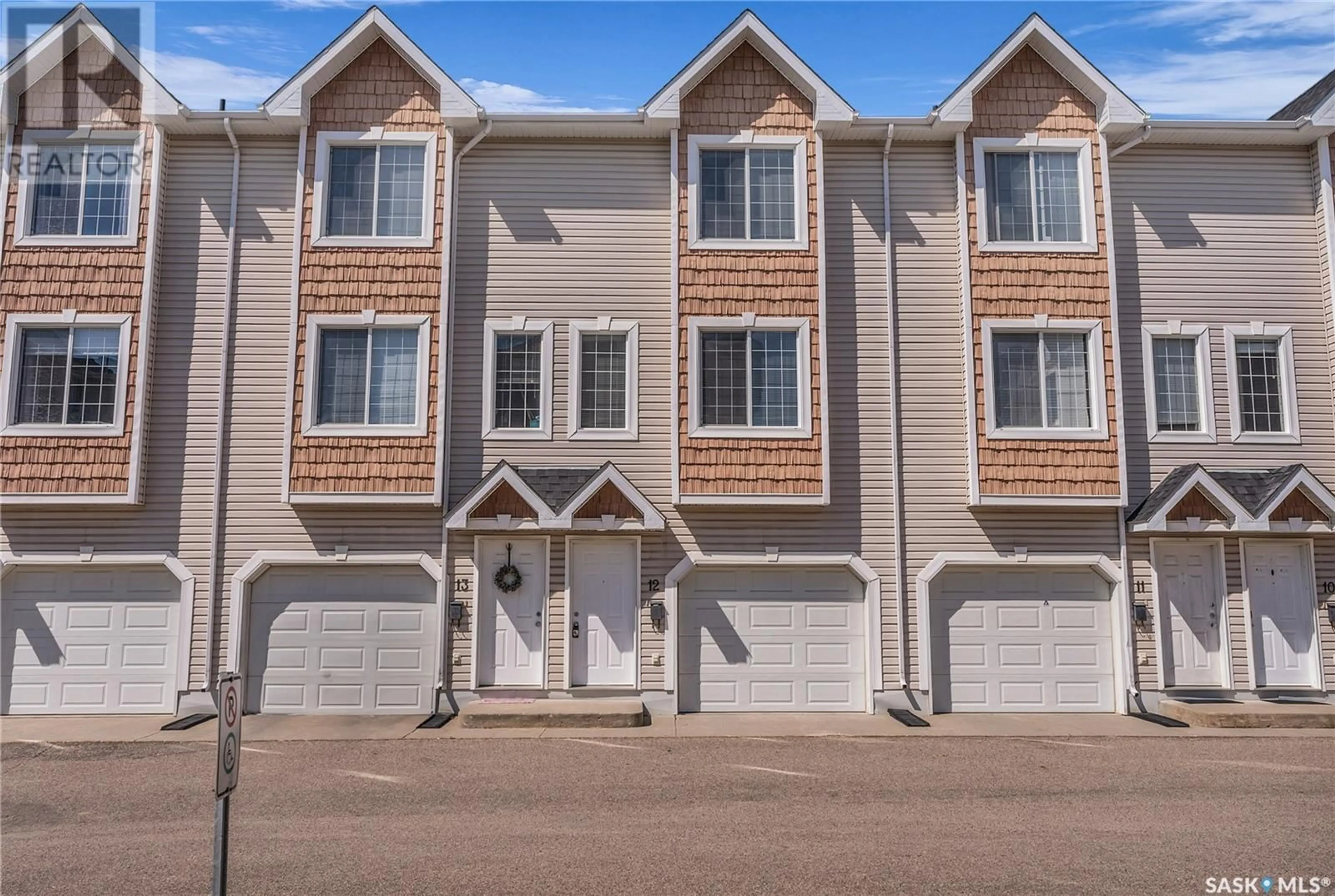 Home with vinyl exterior material, street for 12 243 HEROLD TERRACE, Saskatoon Saskatchewan S7V1J6