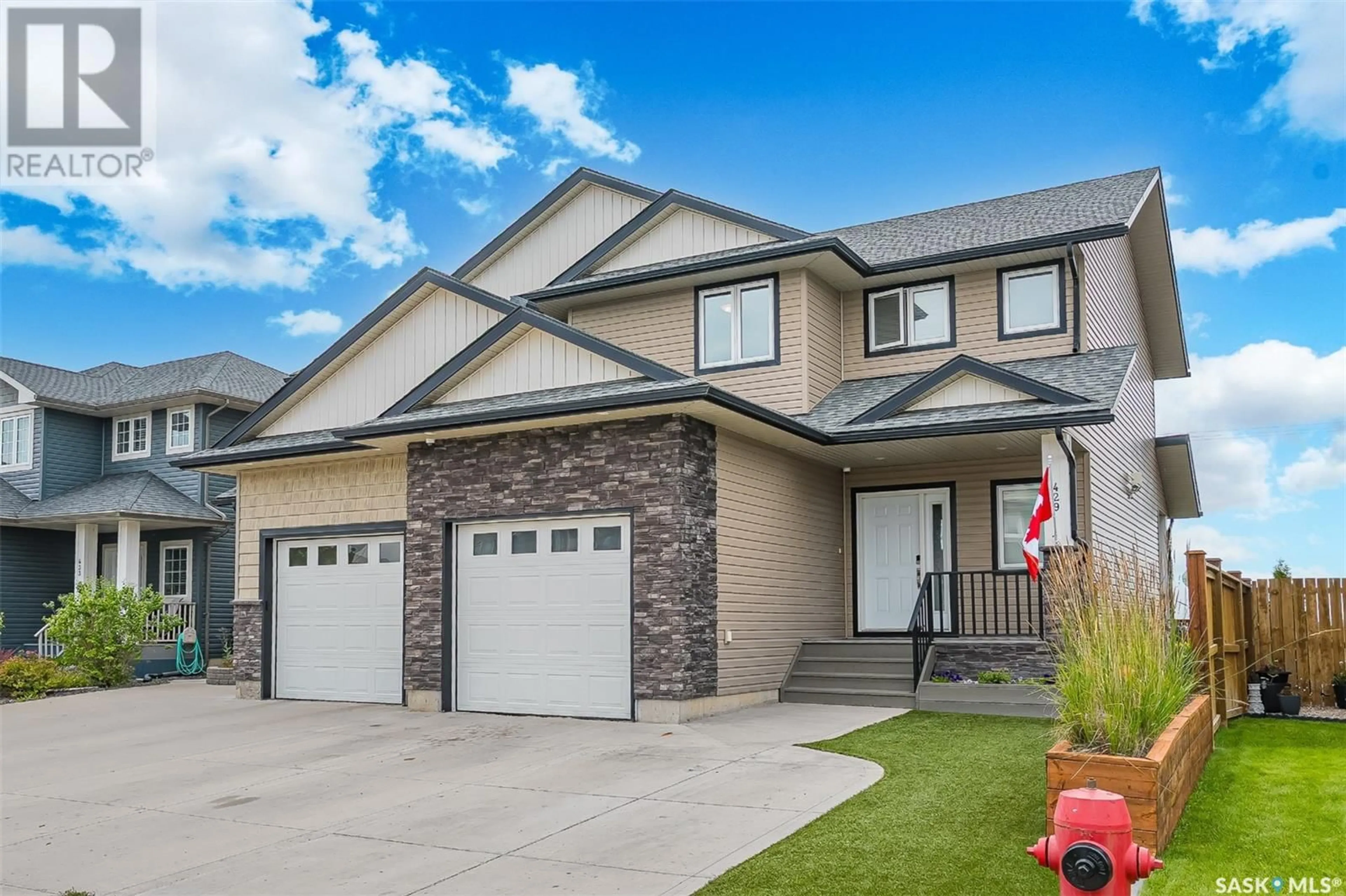 Home with vinyl exterior material, street for 429 REDWOOD CRESCENT, Warman Saskatchewan S0K4S0