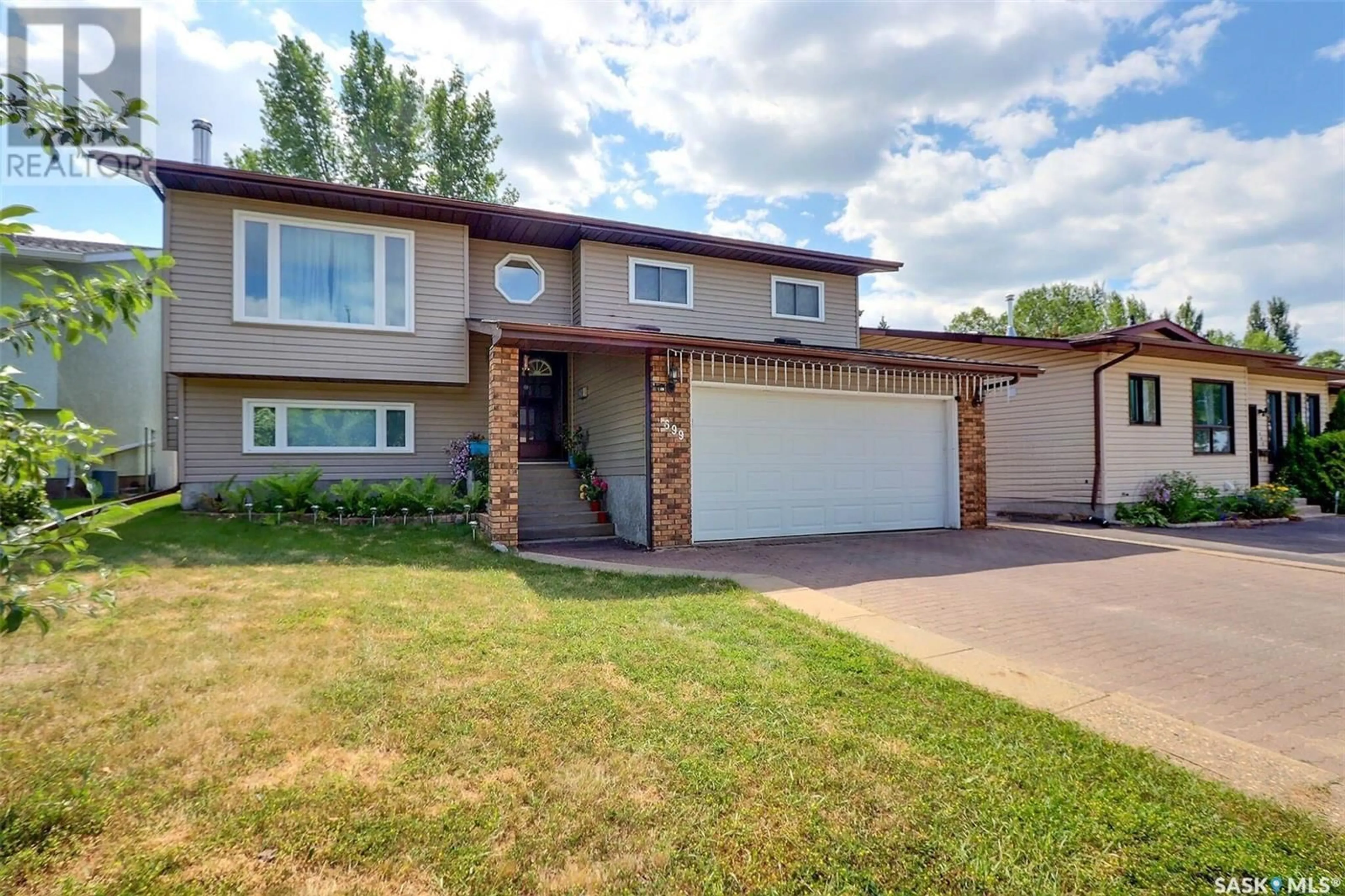 Home with vinyl exterior material, street for 1699 ALLBRIGHT CRESCENT, Prince Albert Saskatchewan S6V7C3