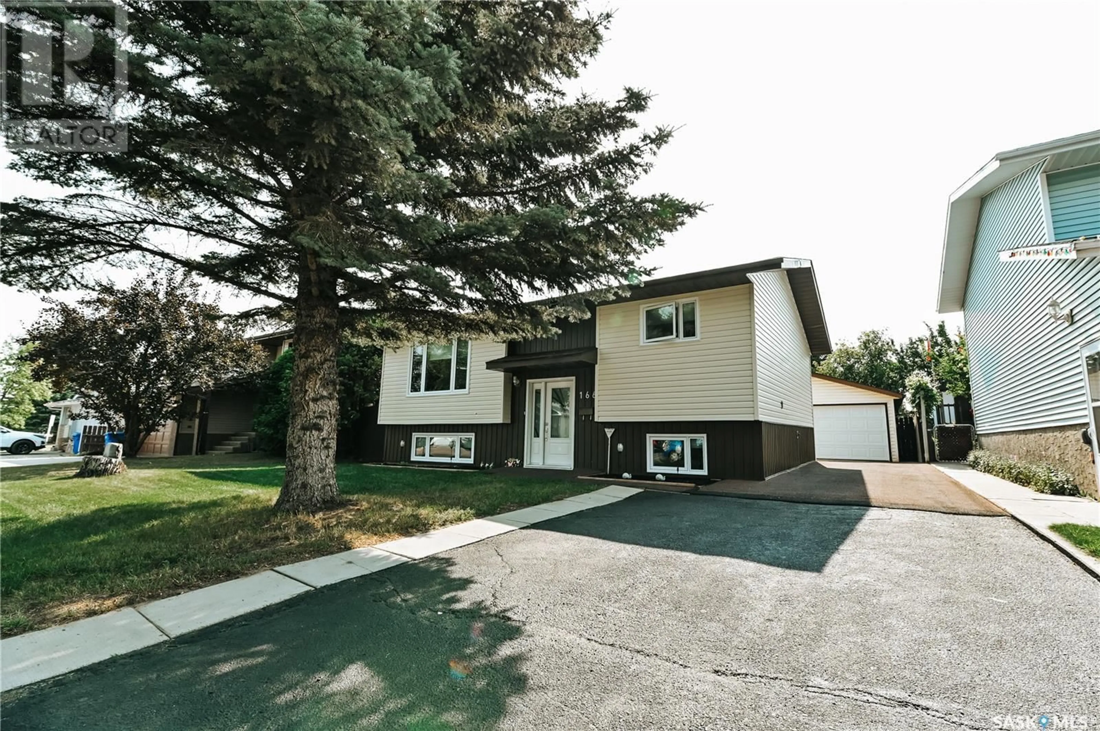 Home with vinyl exterior material, street for 1661 OLIVE DIEFENBAKER DRIVE, Prince Albert Saskatchewan S6V7V9