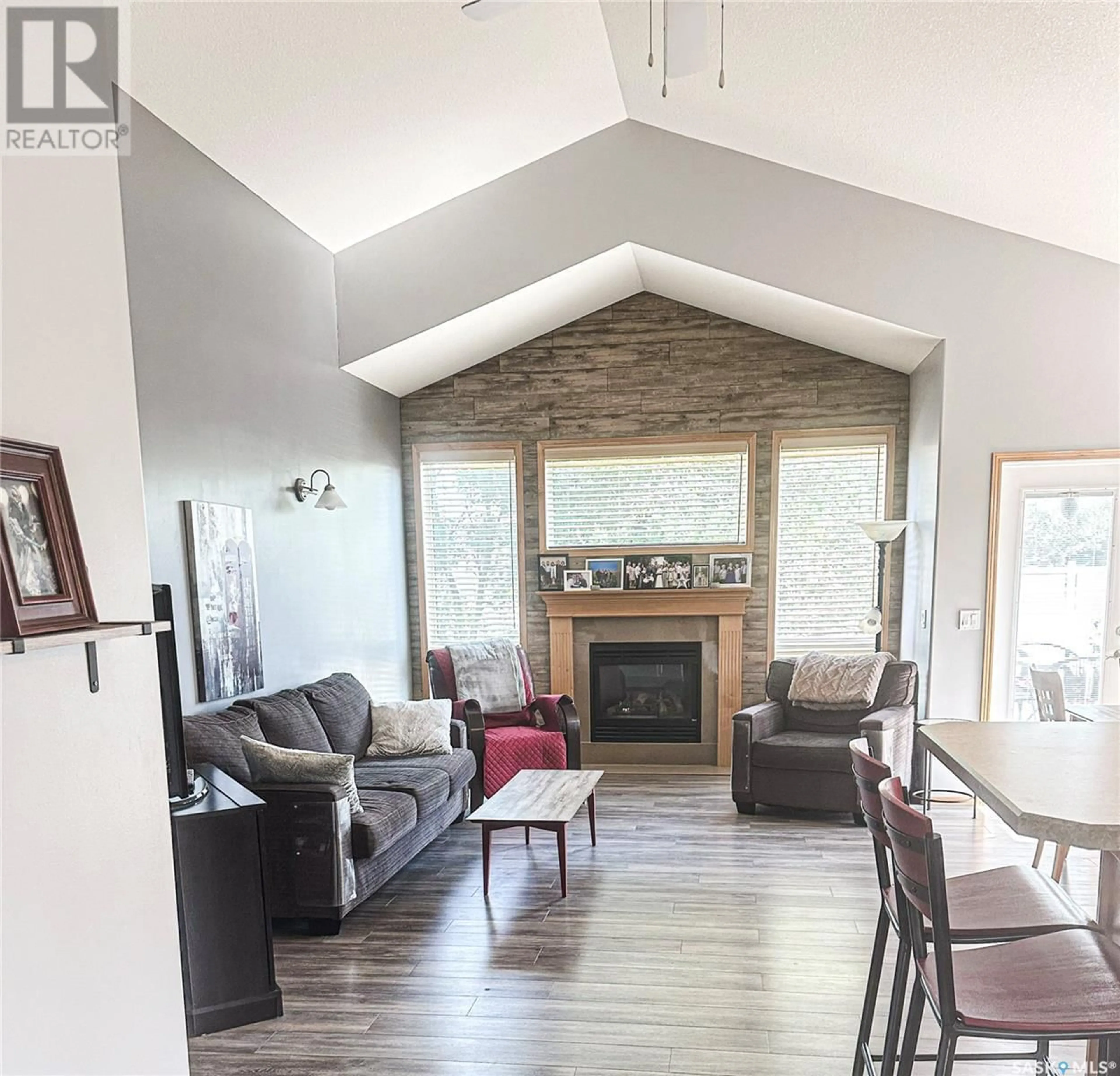 Living room with furniture, wood/laminate floor for 8002 KNOX PLACE, Regina Saskatchewan S4Y1G5