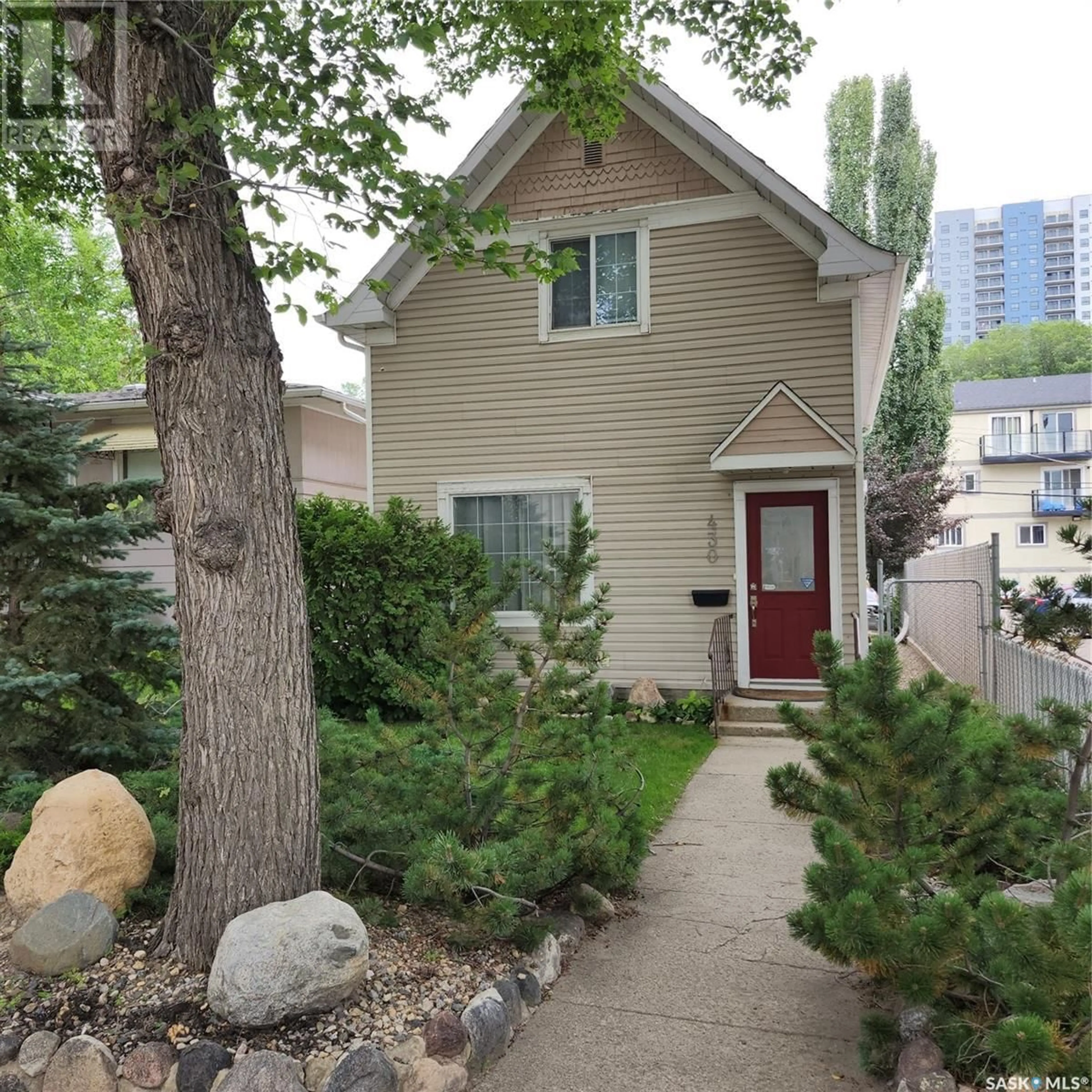 Home with vinyl exterior material, street for 430 3RD AVENUE, Saskatoon Saskatchewan S7K2J3