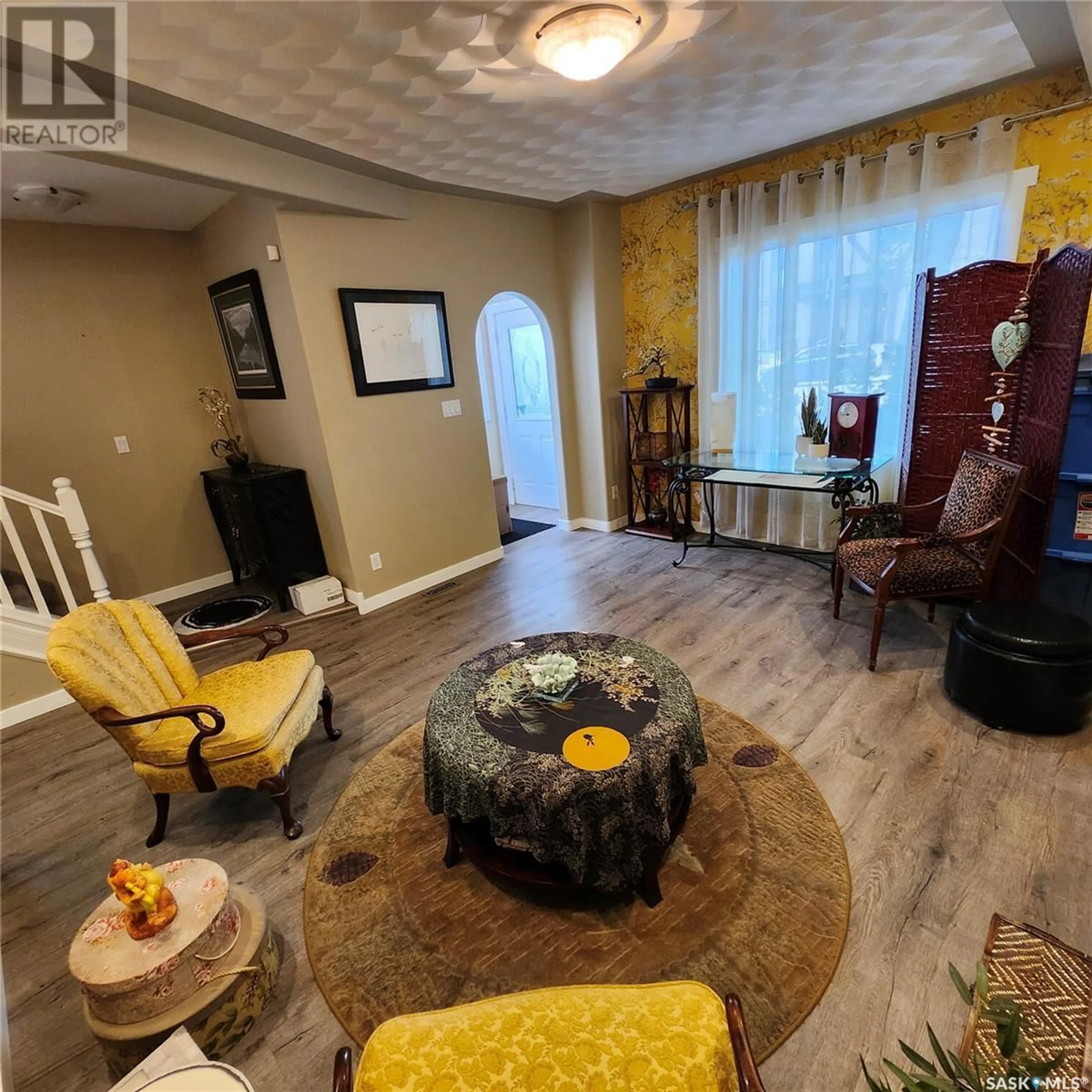 Living room with furniture, wood/laminate floor for 430 3RD AVENUE, Saskatoon Saskatchewan S7K2J3
