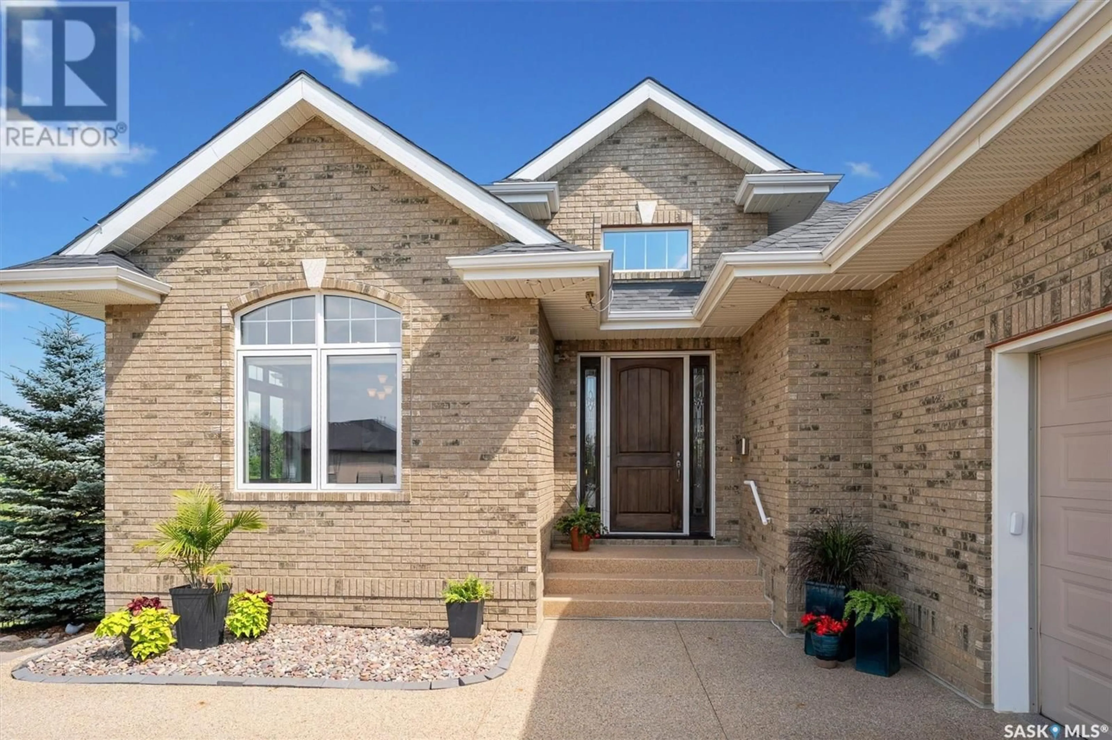 Home with brick exterior material, street for 59 602 CARTWRIGHT STREET, Saskatoon Saskatchewan S7T0G4