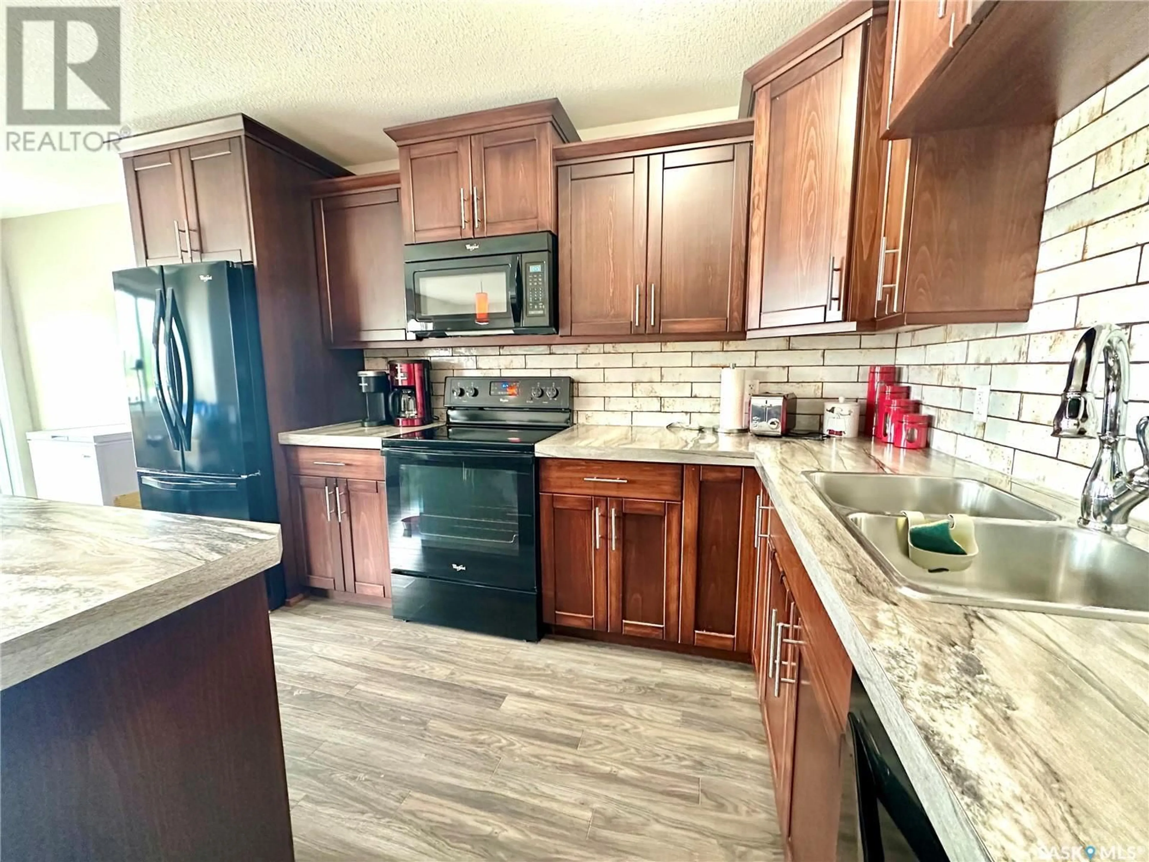 Open concept kitchen, ceramic/tile floor for 2419 HENDERSON DRIVE, North Battleford Saskatchewan S9A0Y3