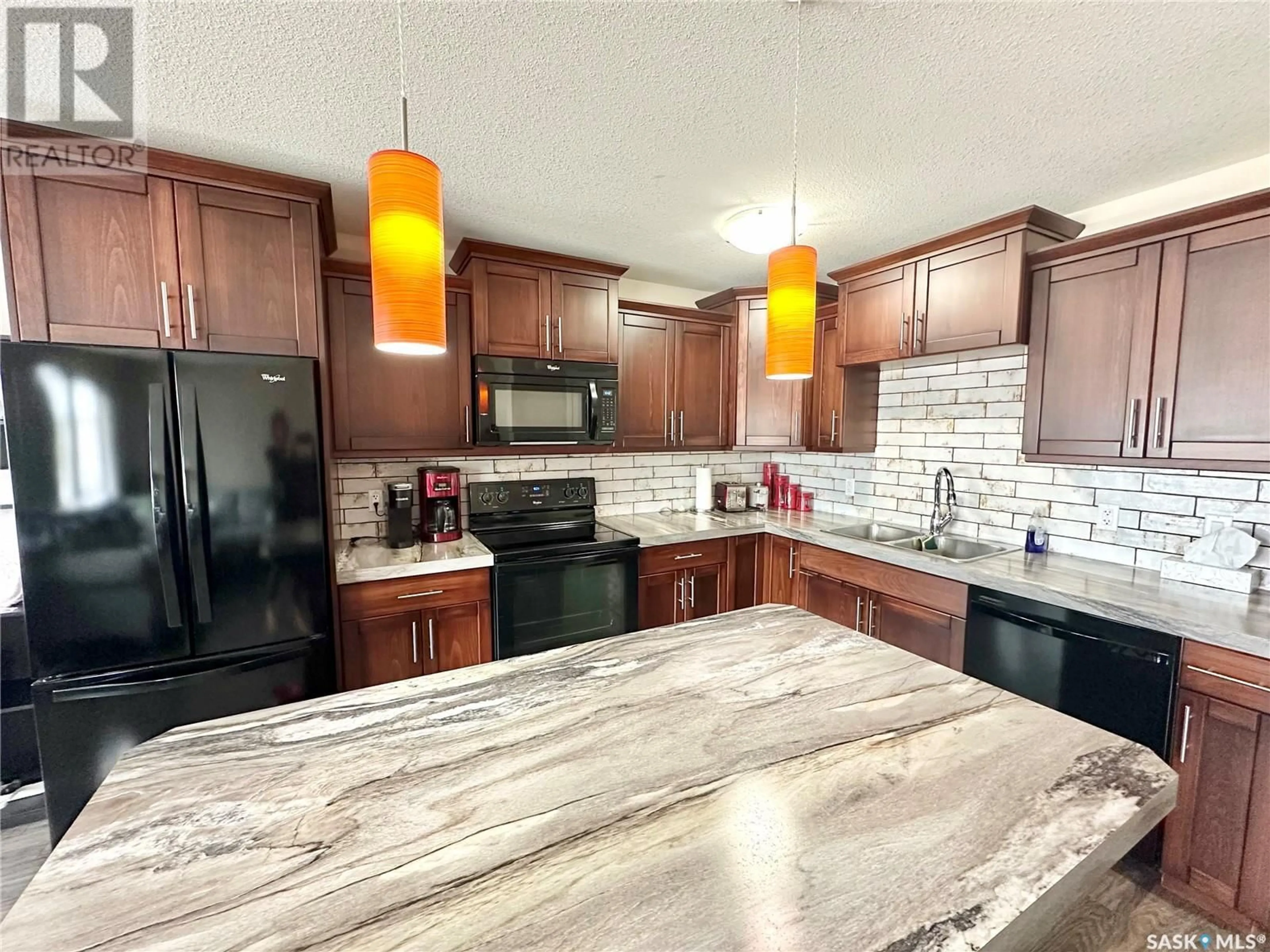 Open concept kitchen, ceramic/tile floor for 2419 HENDERSON DRIVE, North Battleford Saskatchewan S9A0Y3