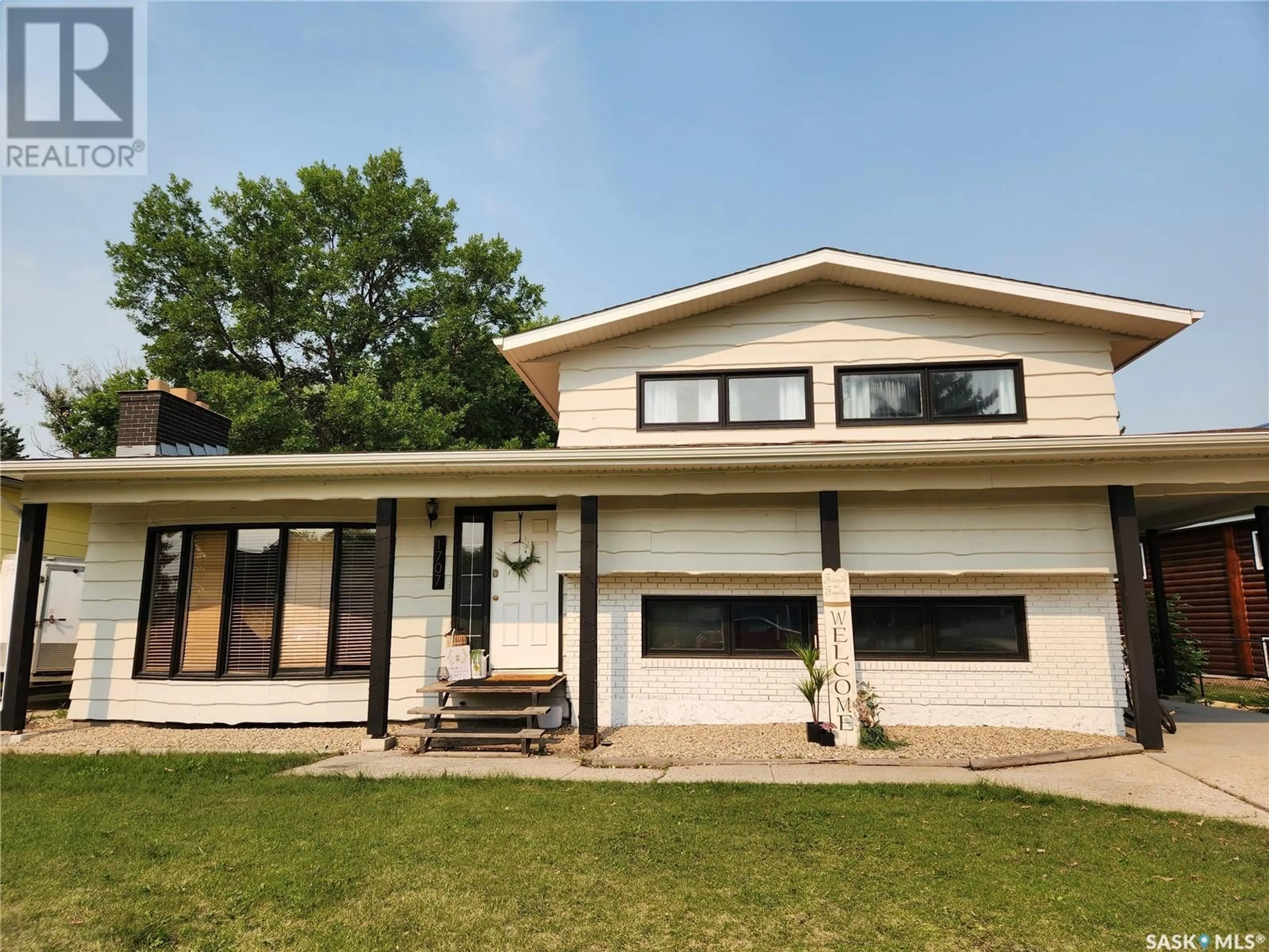 Home with vinyl exterior material, street for 1707 96TH STREET, Tisdale Saskatchewan S0E1T0