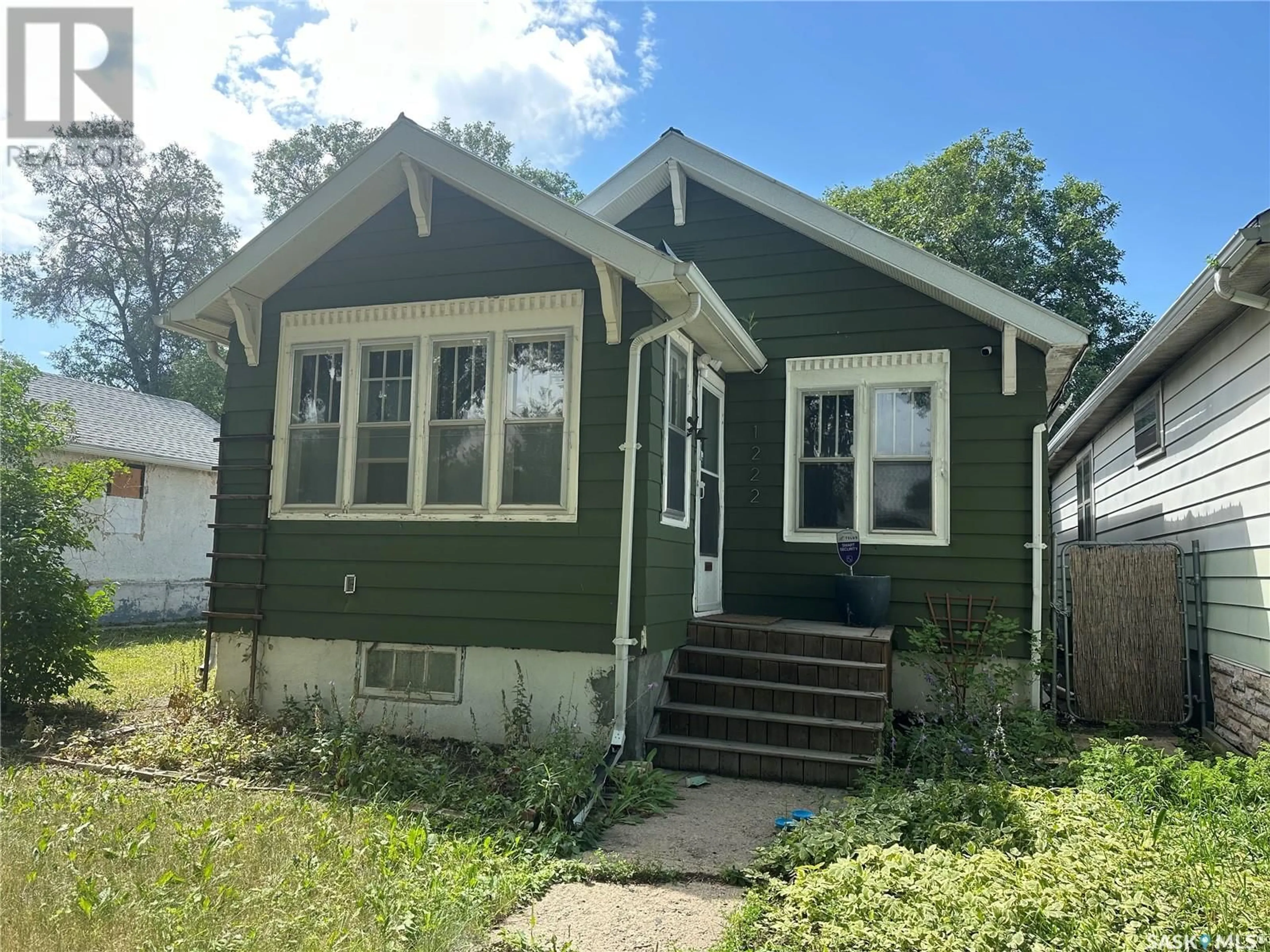 Home with vinyl exterior material, street for 1222 ROBINSON STREET, Regina Saskatchewan S4T2N2