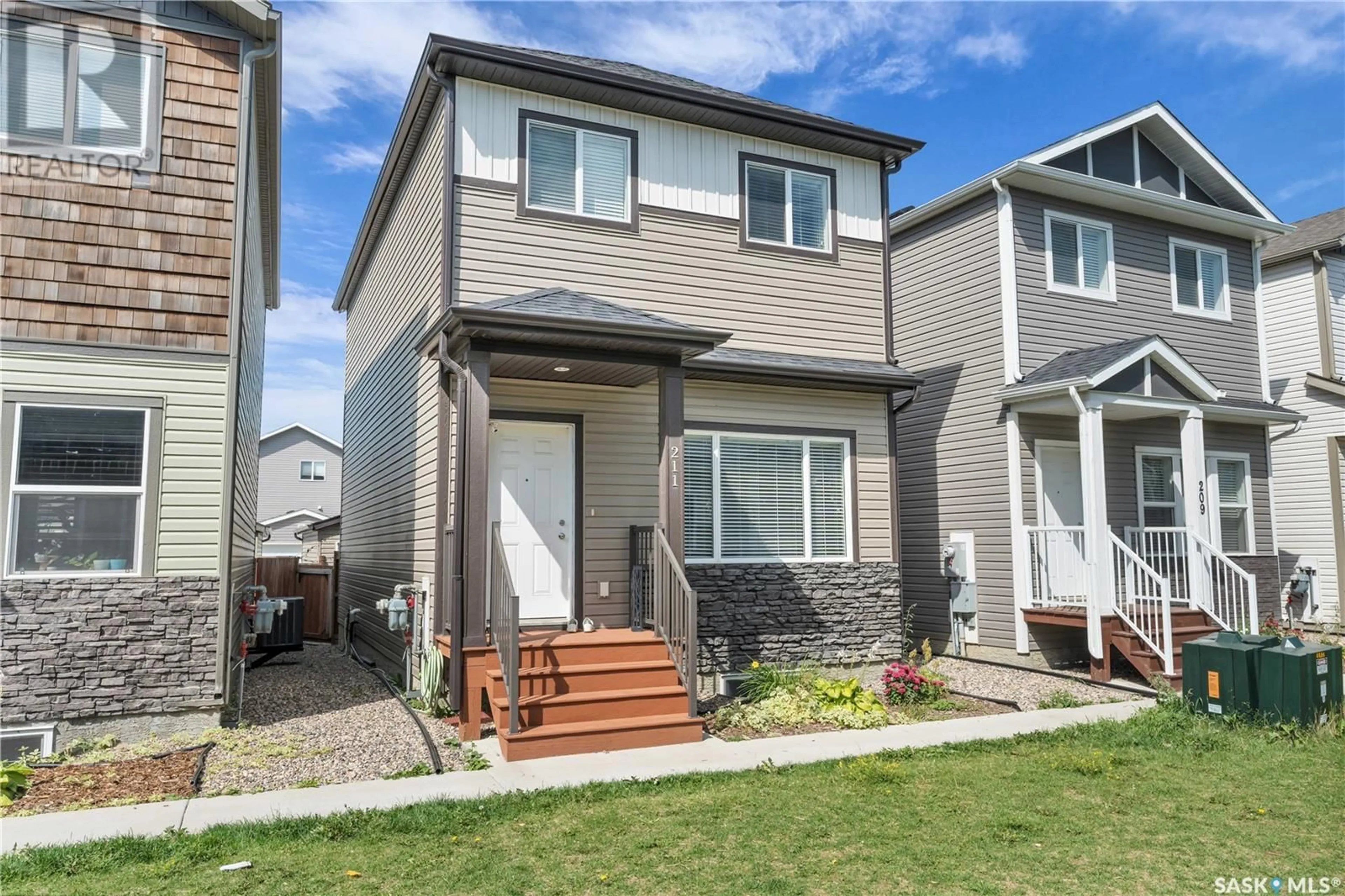 Home with vinyl exterior material, street for 211 1615 RICHARDSON ROAD, Saskatoon Saskatchewan S7R0M7