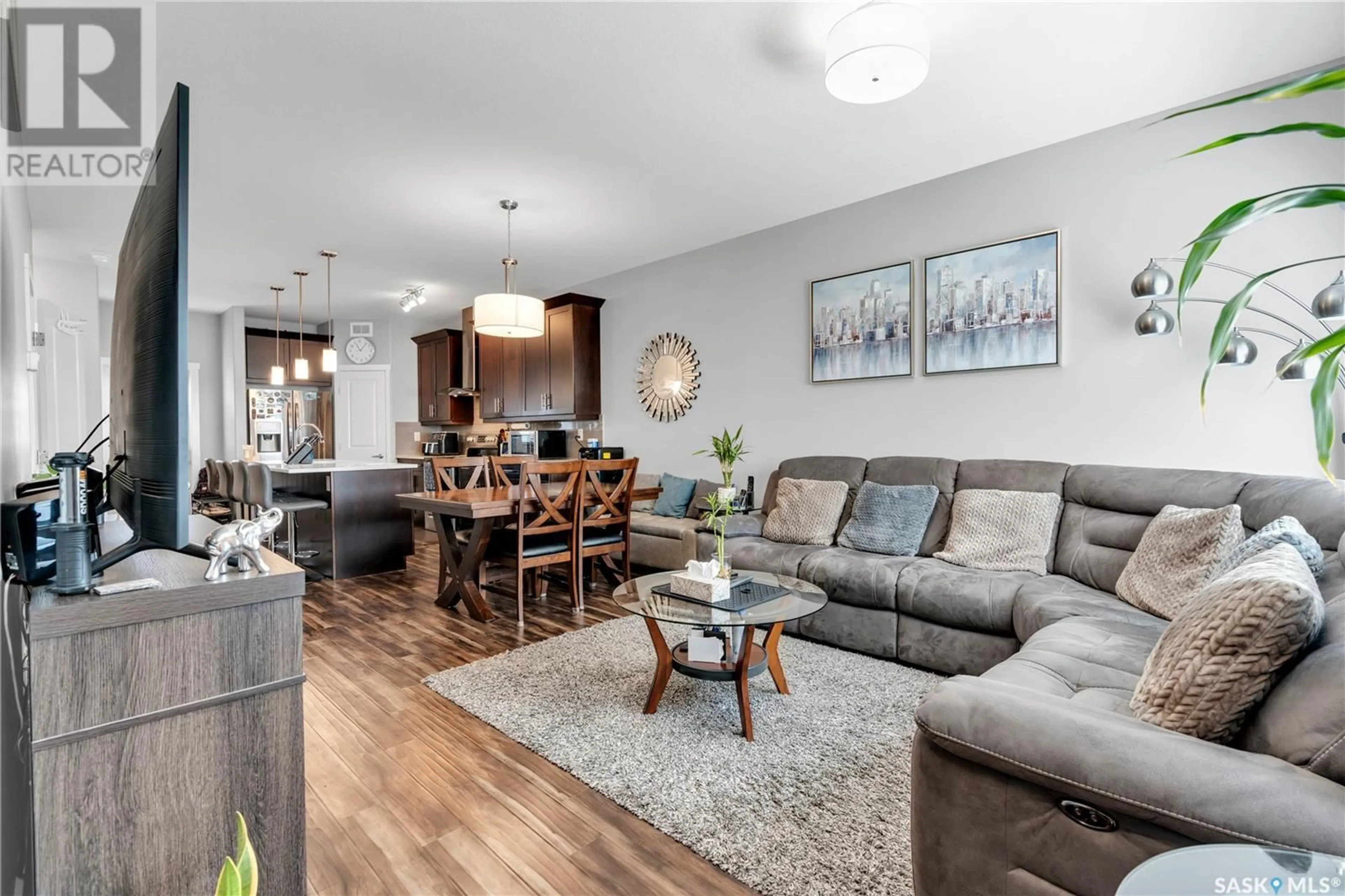 Living room with furniture, wood/laminate floor for 211 1615 RICHARDSON ROAD, Saskatoon Saskatchewan S7R0M7