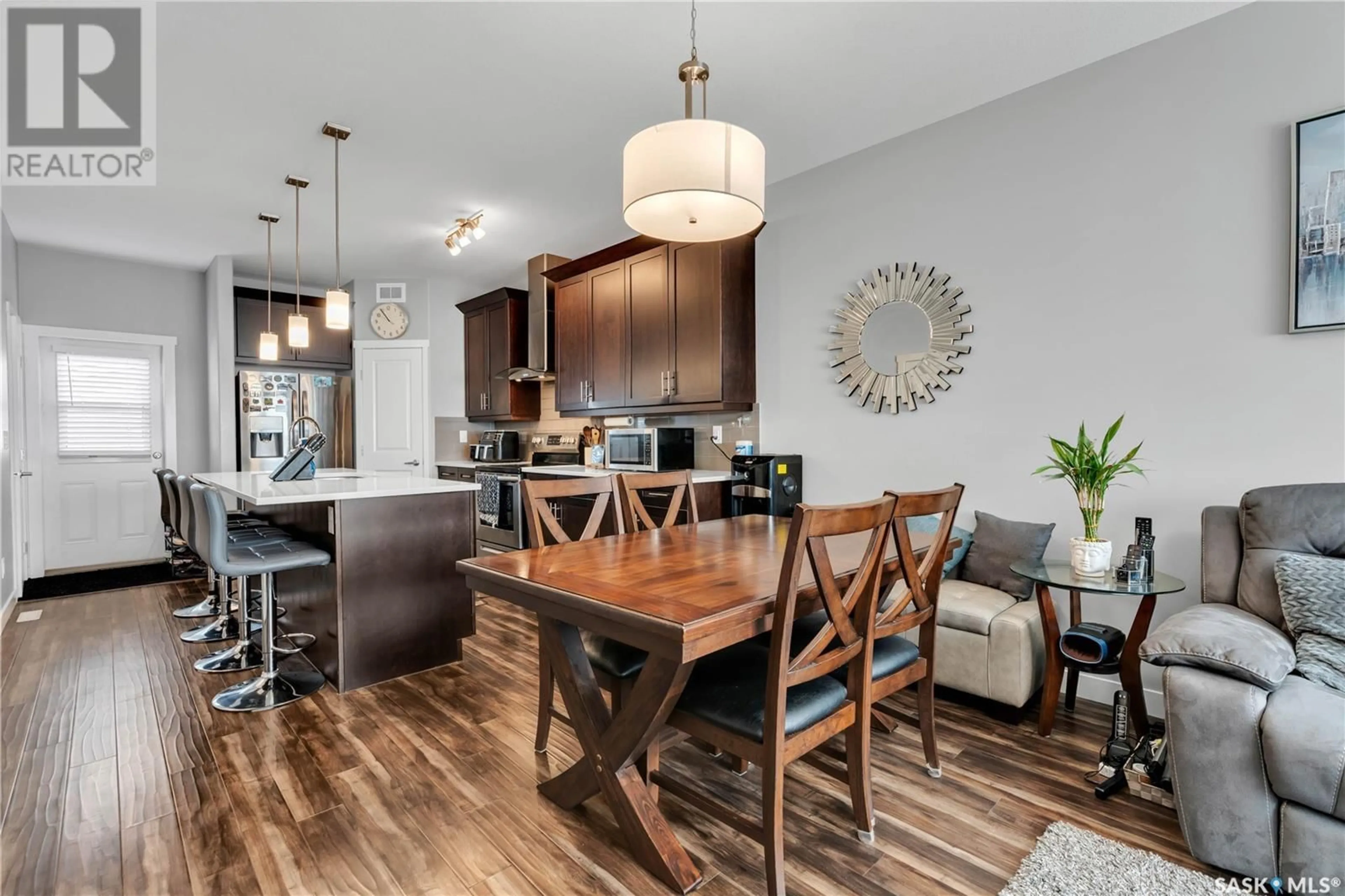 Open concept kitchen, wood/laminate floor for 211 1615 RICHARDSON ROAD, Saskatoon Saskatchewan S7R0M7