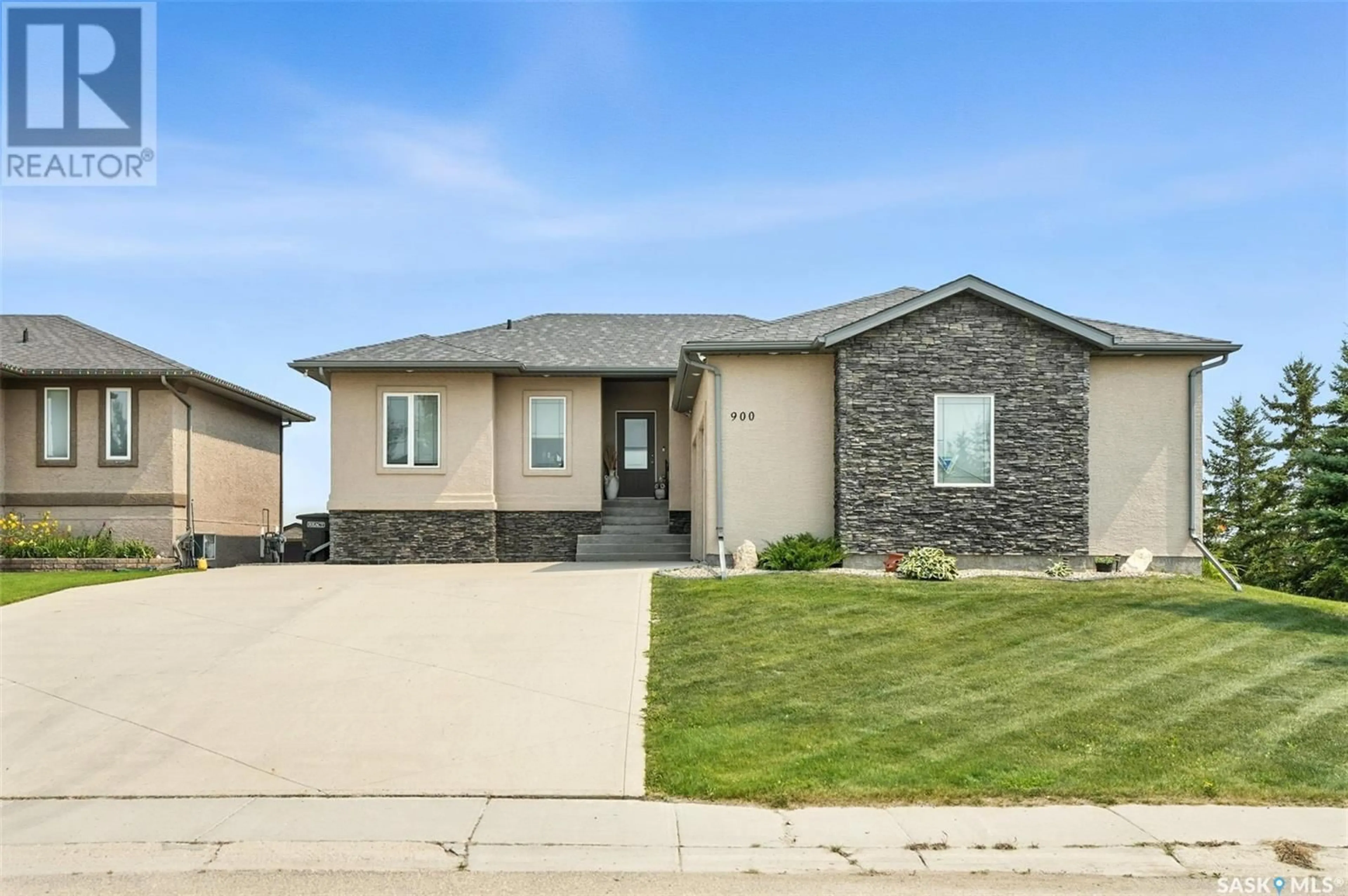 Home with brick exterior material, street for 900 WATER RIDGE CRESCENT, Humboldt Saskatchewan S0K2A0