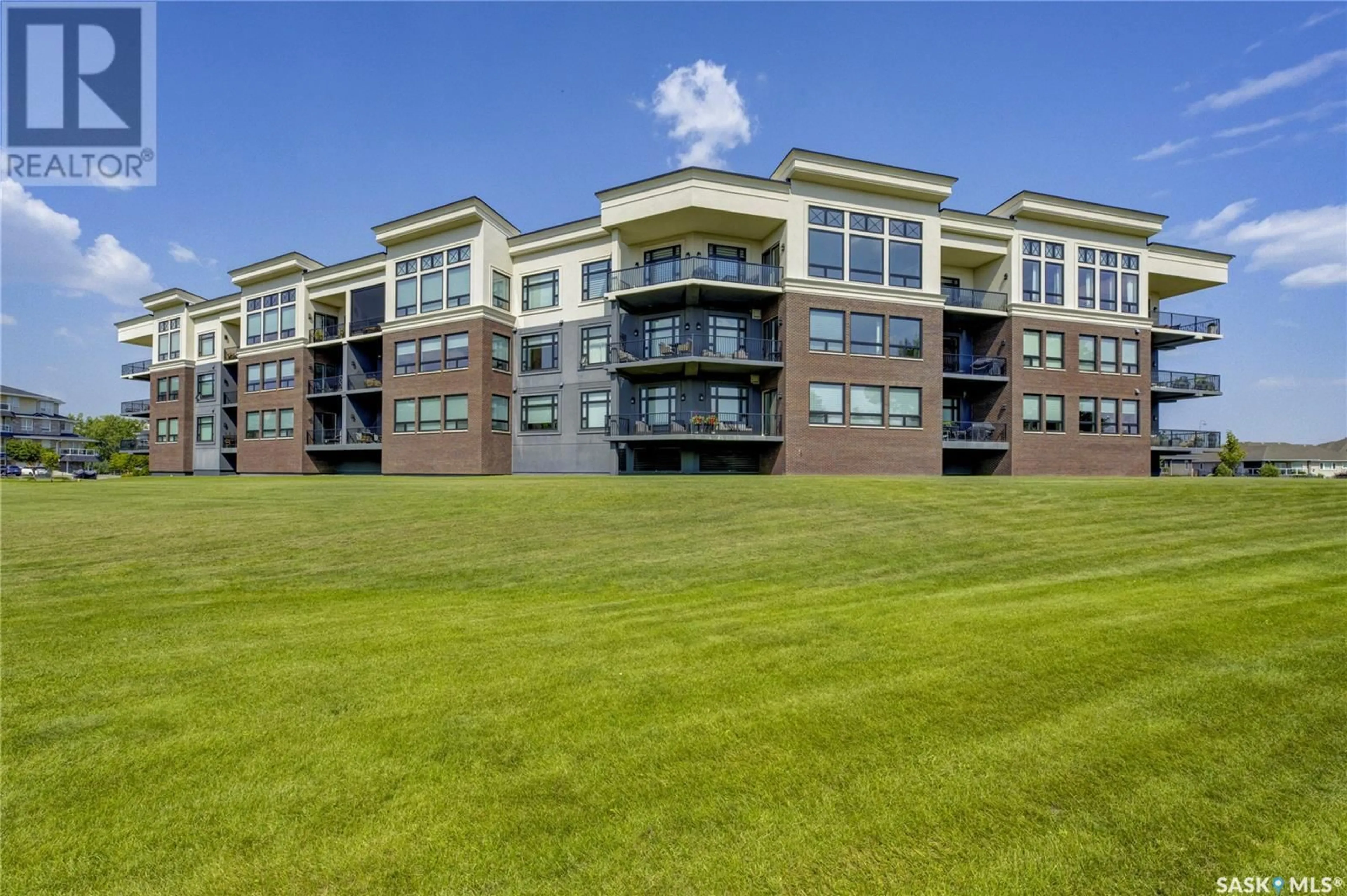 A pic from outside/outdoor area/front of a property/back of a property/a pic from drone, water/lake/river/ocean view for 208 - 404 CARTWRIGHT STREET, Saskatoon Saskatchewan S7T0W6
