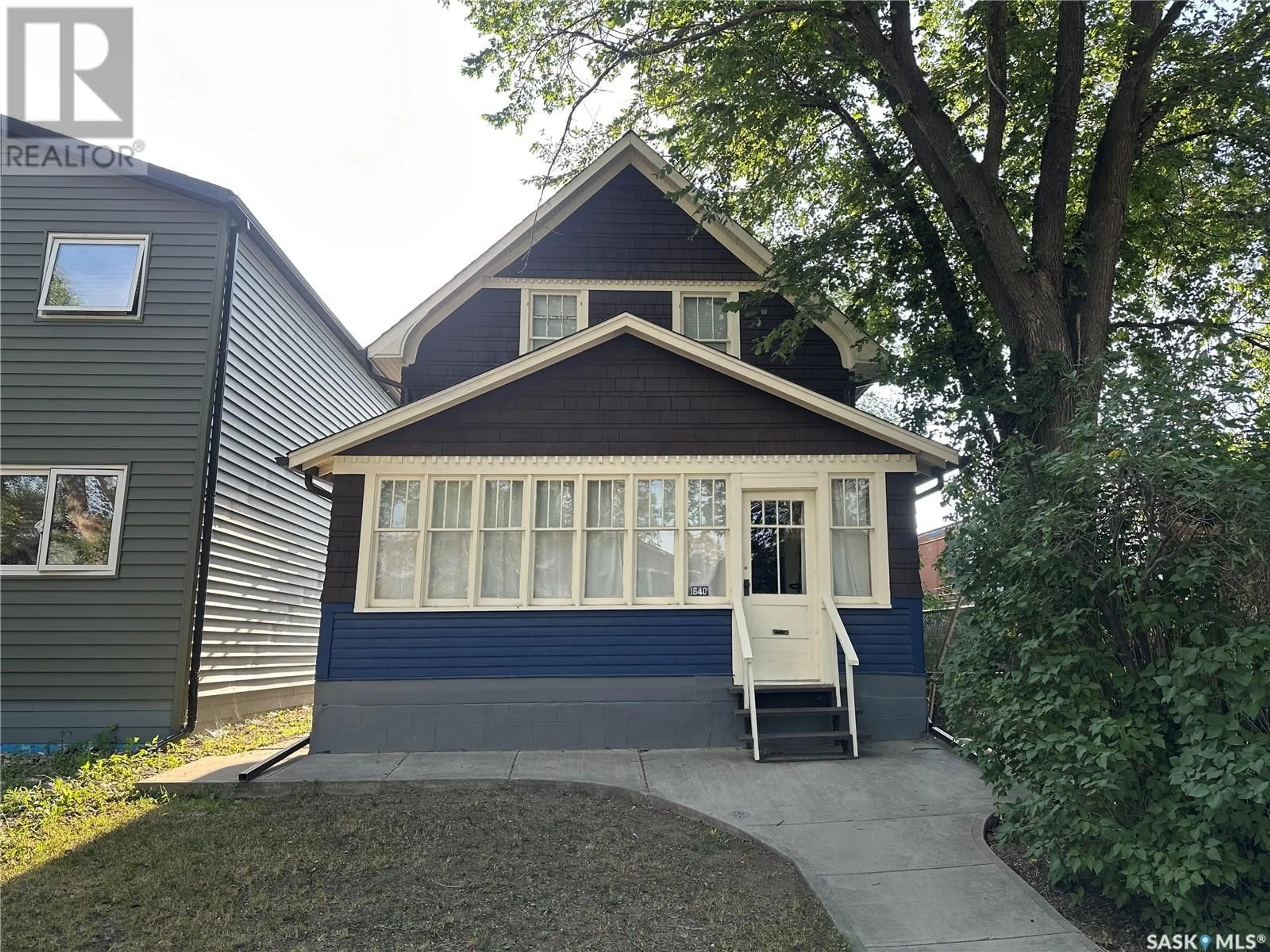 Home with vinyl exterior material, street for 1640 OTTAWA STREET, Regina Saskatchewan S4P1N9