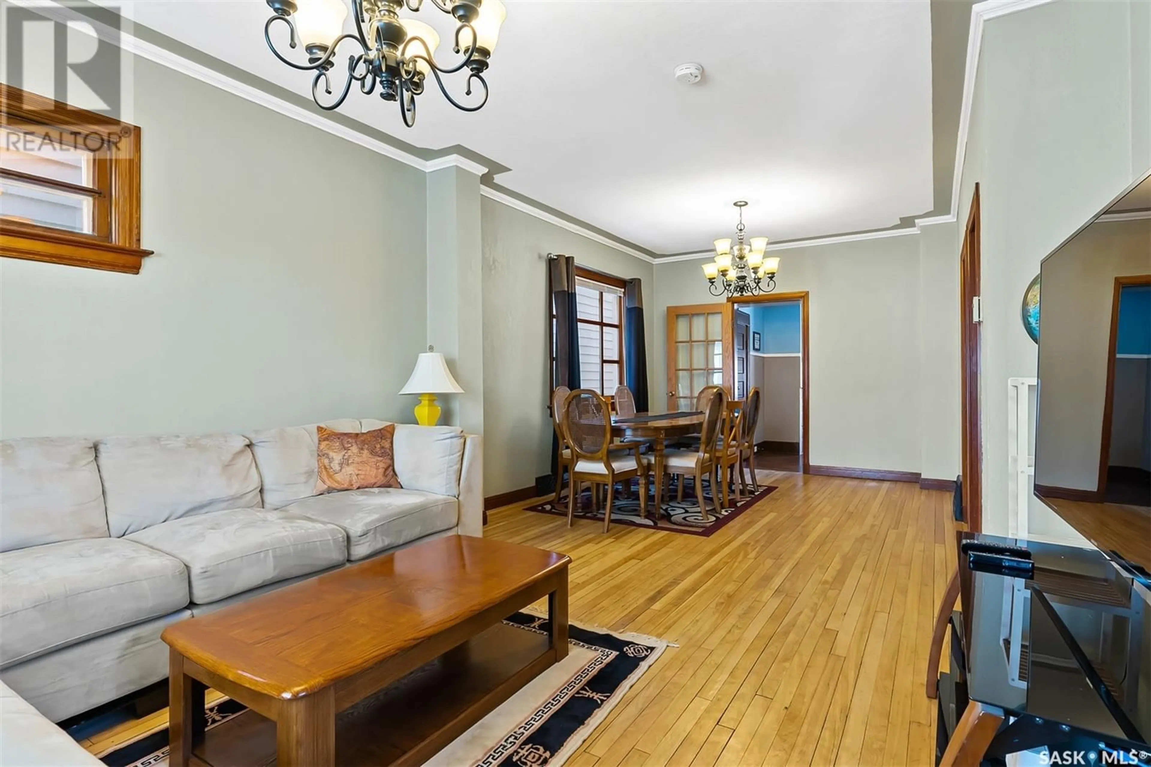 Living room with furniture, wood/laminate floor for 1640 OTTAWA STREET, Regina Saskatchewan S4P1N9