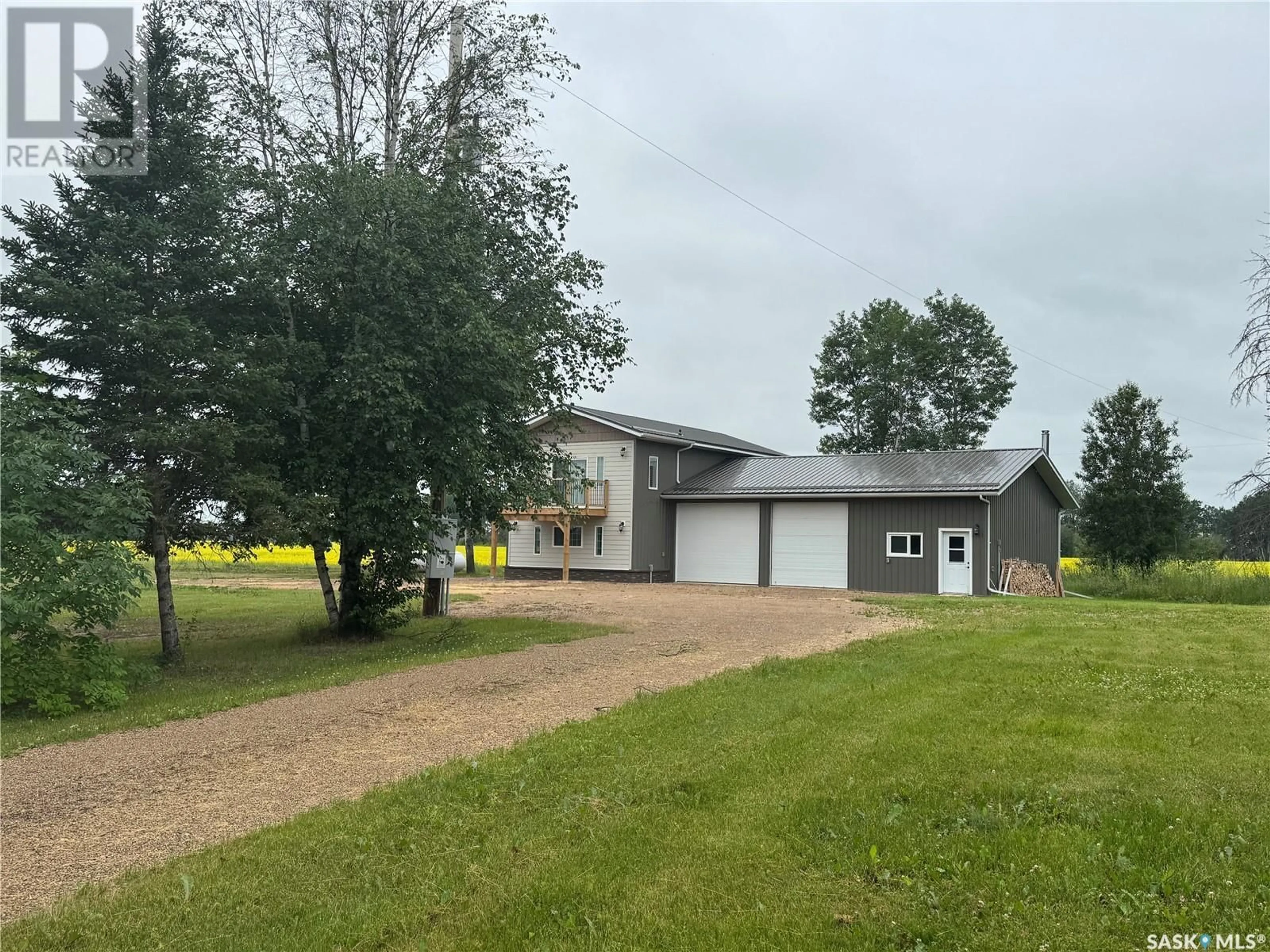 A pic from outside/outdoor area/front of a property/back of a property/a pic from drone, unknown for 2.94 ACRES WITH ATTACHED GARAGE, Hudson Bay Rm No. 394 Saskatchewan S0E0Y0