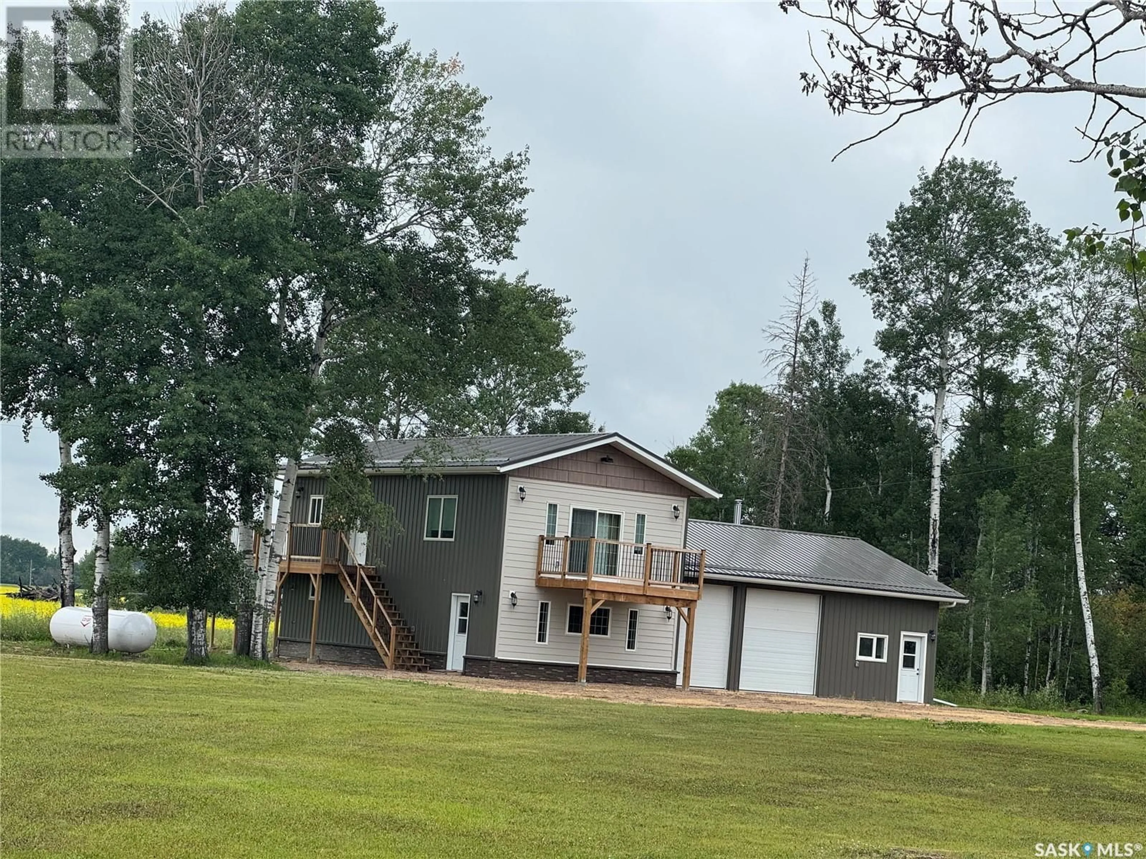 A pic from outside/outdoor area/front of a property/back of a property/a pic from drone, unknown for 2.94 ACRES WITH ATTACHED GARAGE, Hudson Bay Rm No. 394 Saskatchewan S0E0Y0