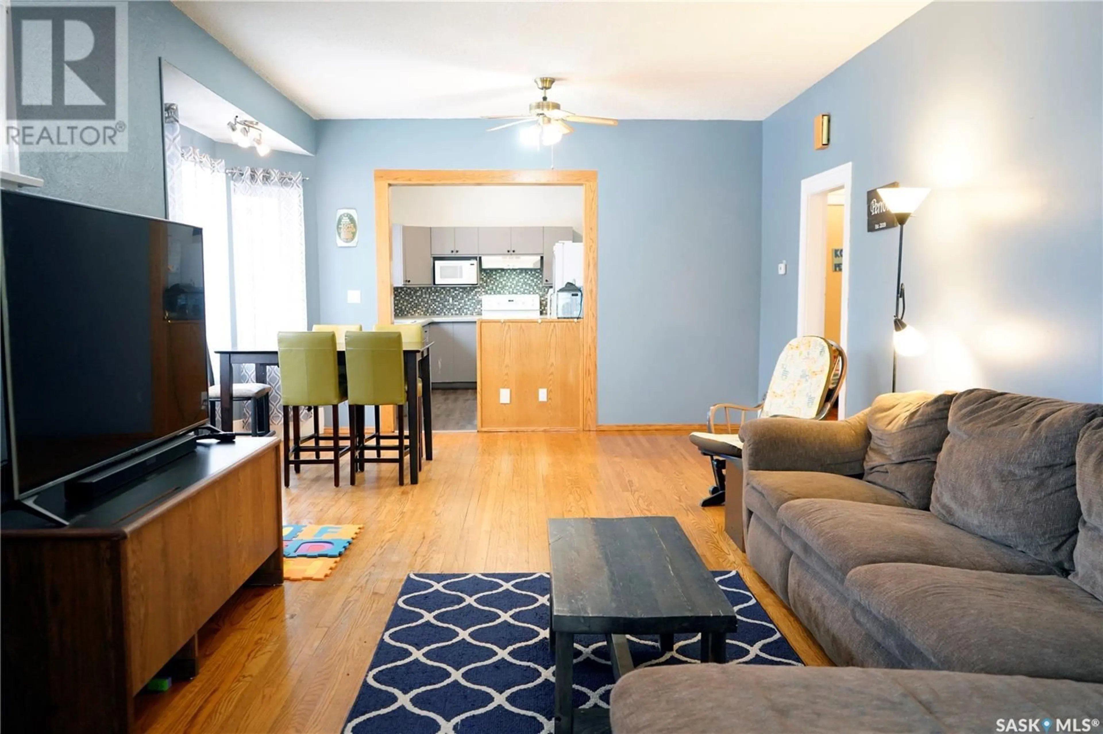 Living room with furniture, wood/laminate floor for 394 2ND STREET, Shaunavon Saskatchewan S0N2M0
