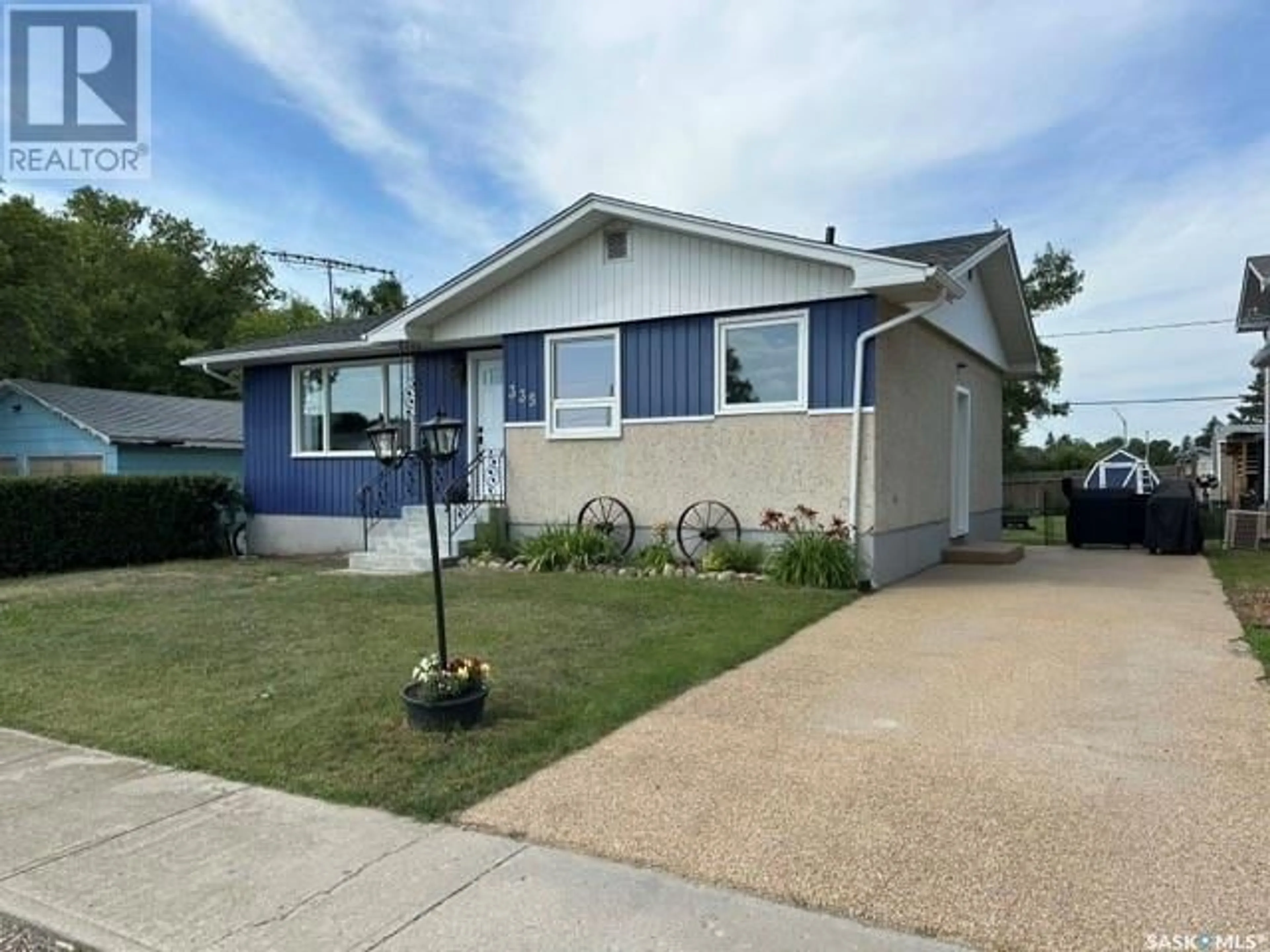 Home with vinyl exterior material, street for 335 BYRON STREET, Southey Saskatchewan S0G4P0