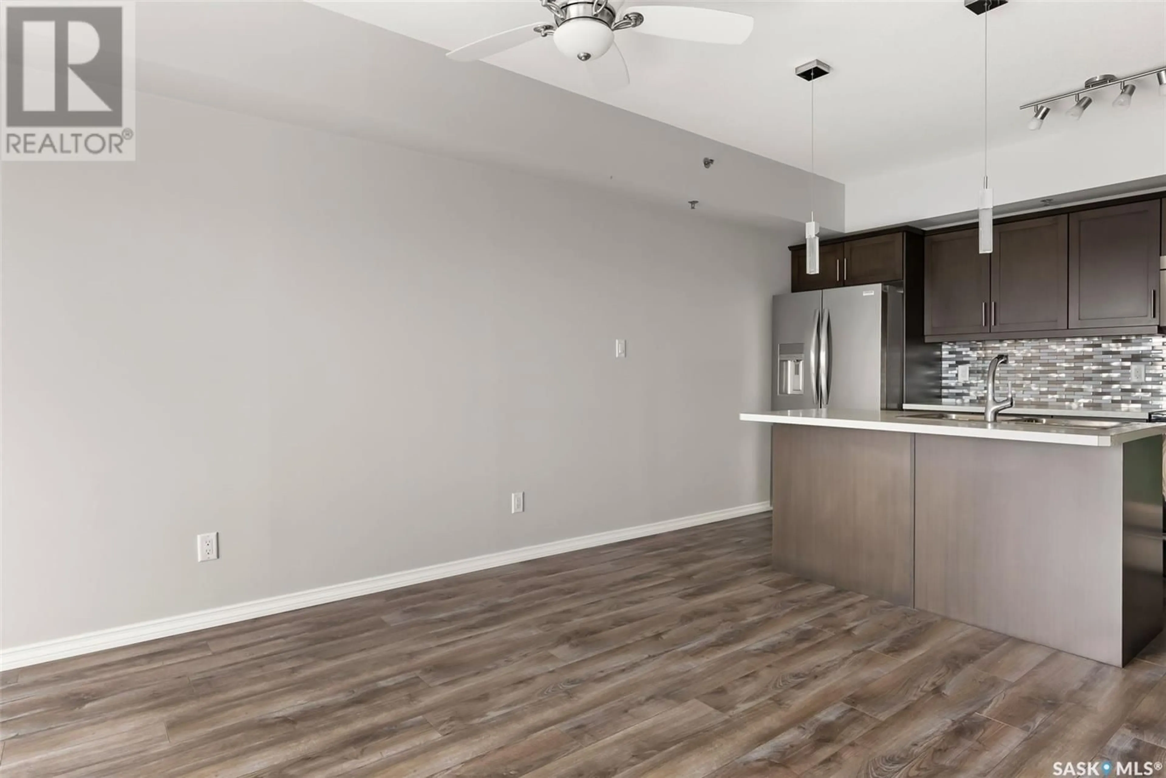Open concept kitchen, wood/laminate floor for 408 - 4501 CHILD AVENUE, Regina Saskatchewan S4X0L7