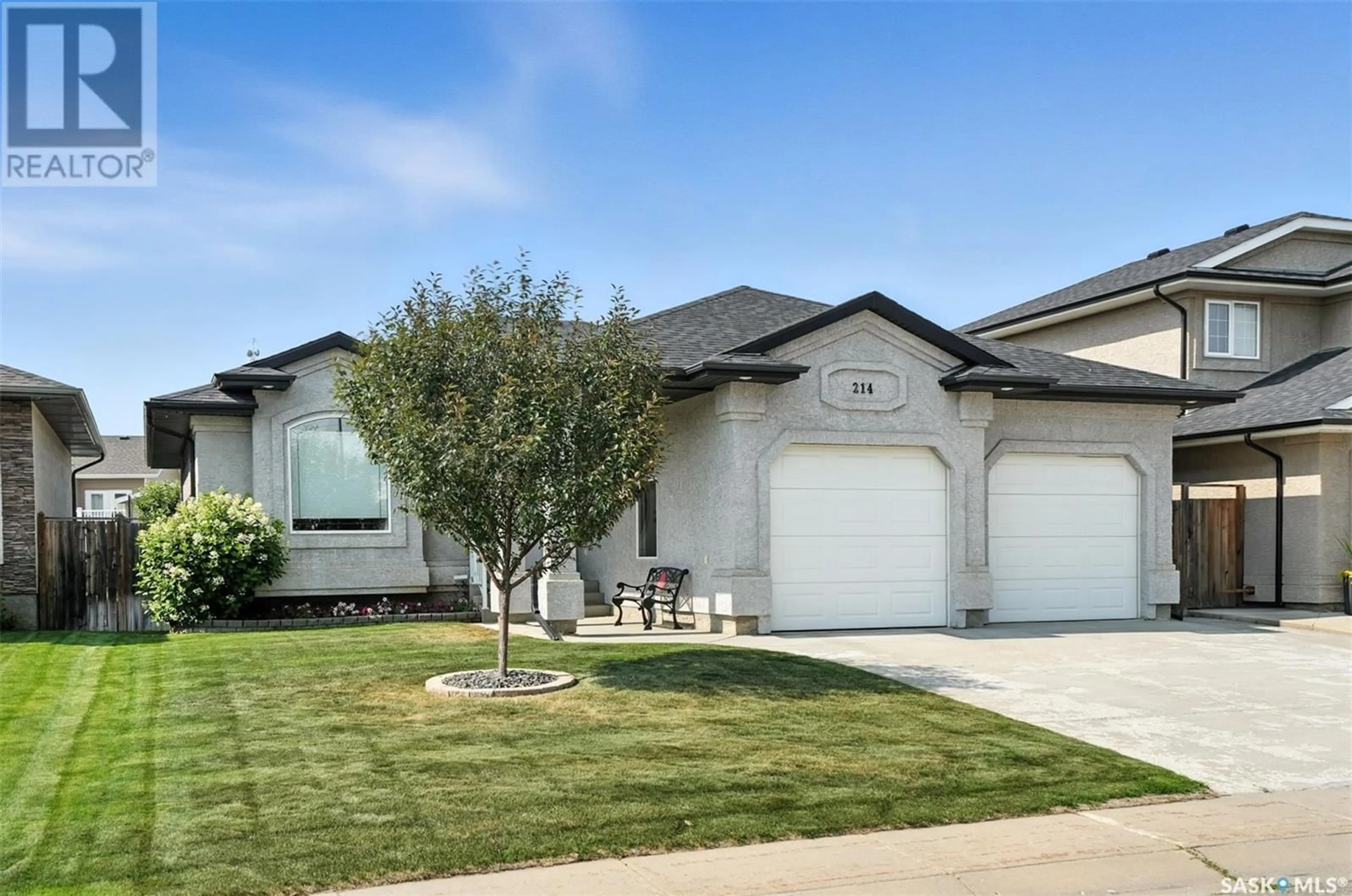 Home with vinyl exterior material, street for 214 LAKERIDGE DRIVE, Warman Saskatchewan S0K0A1