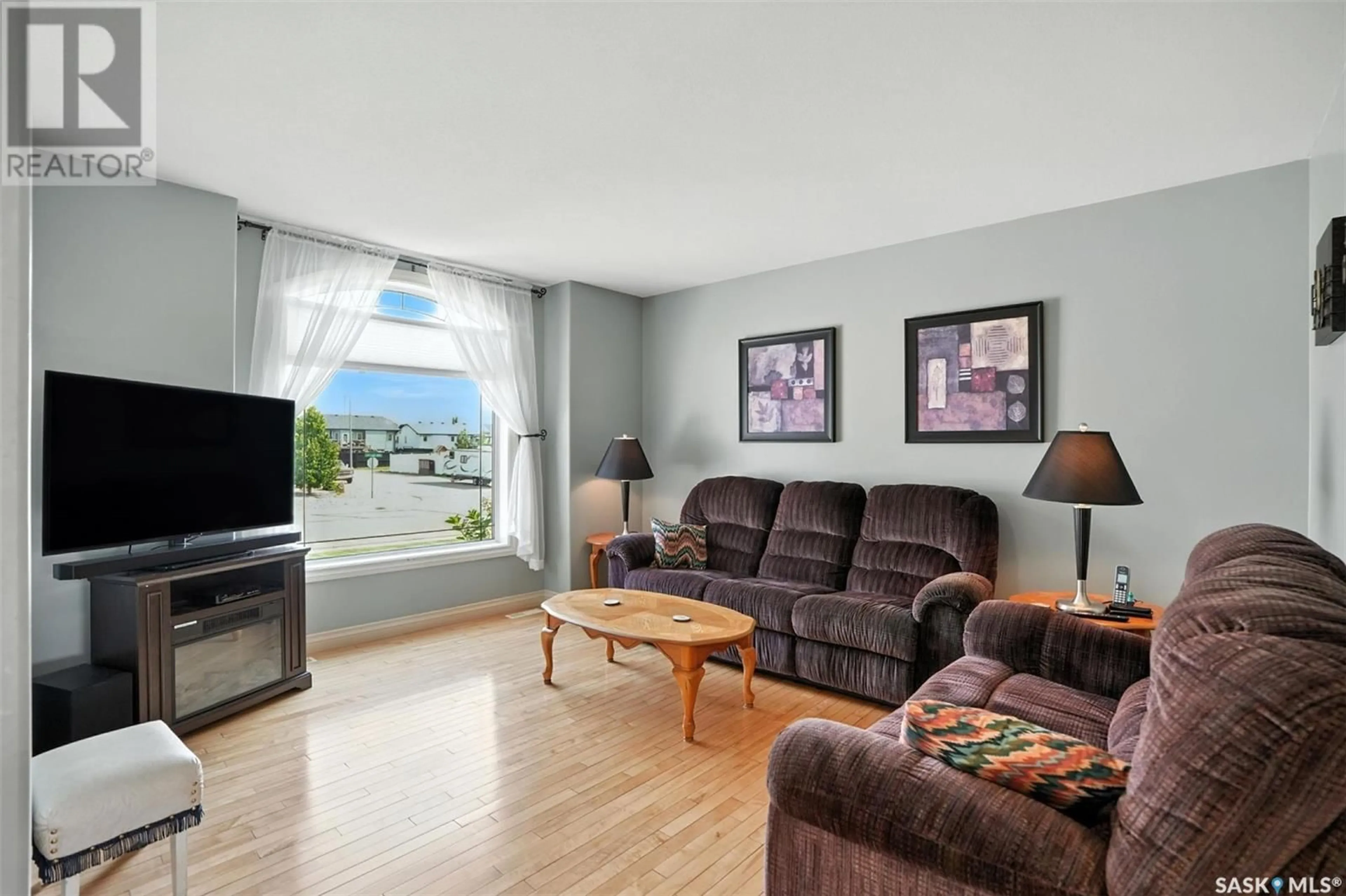 Living room with furniture, unknown for 214 LAKERIDGE DRIVE, Warman Saskatchewan S0K0A1