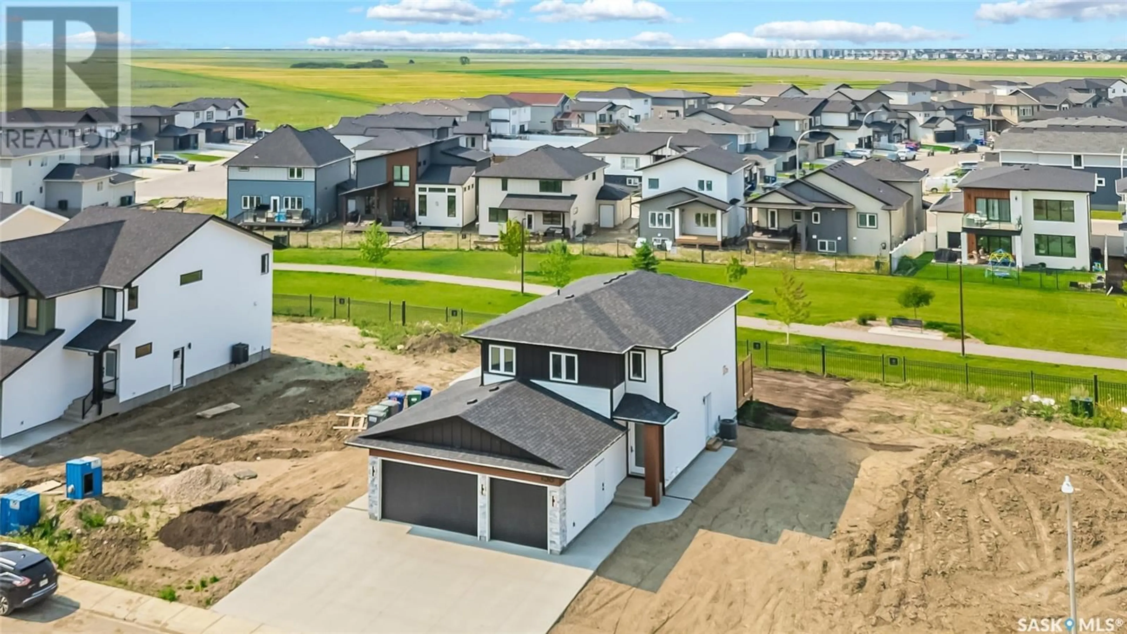 A pic from outside/outdoor area/front of a property/back of a property/a pic from drone, unknown for 158 HAVERSTOCK CRESCENT, Saskatoon Saskatchewan S7W1E3