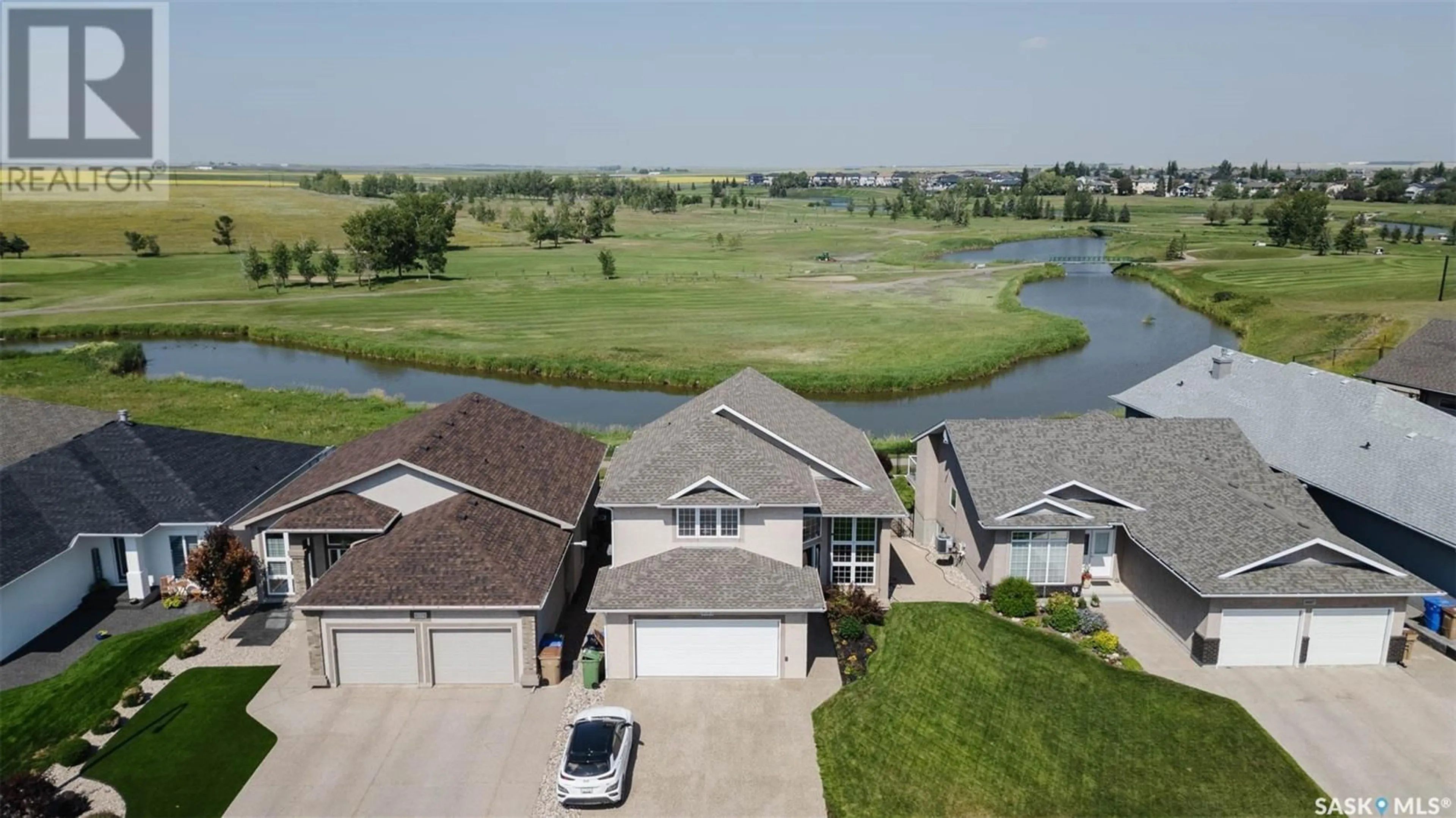 A pic from outside/outdoor area/front of a property/back of a property/a pic from drone, water/lake/river/ocean view for 8083 FAIRWAYS WEST DRIVE, Regina Saskatchewan S4Y0A4