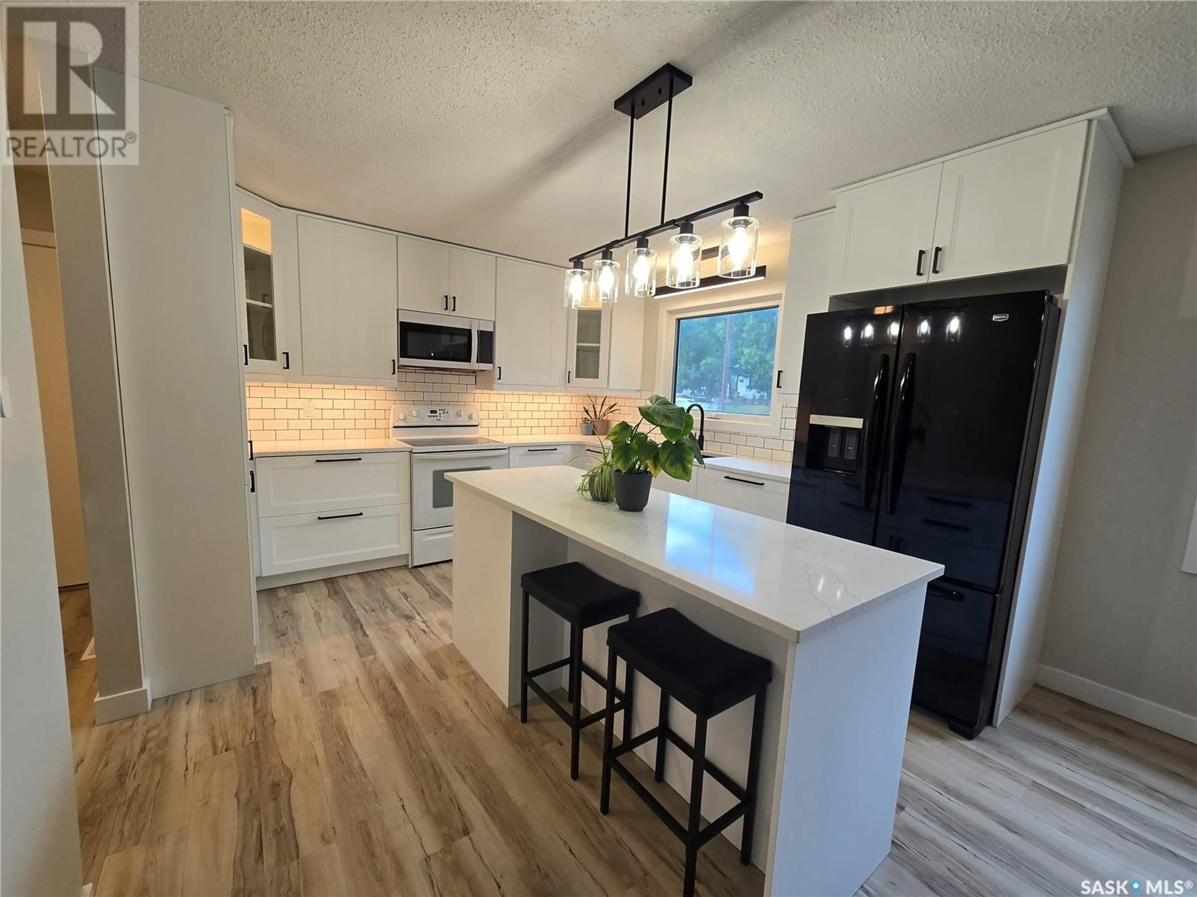 Open concept kitchen, unknown for 214 PELLETIER DRIVE, Swift Current Saskatchewan S9H4K4
