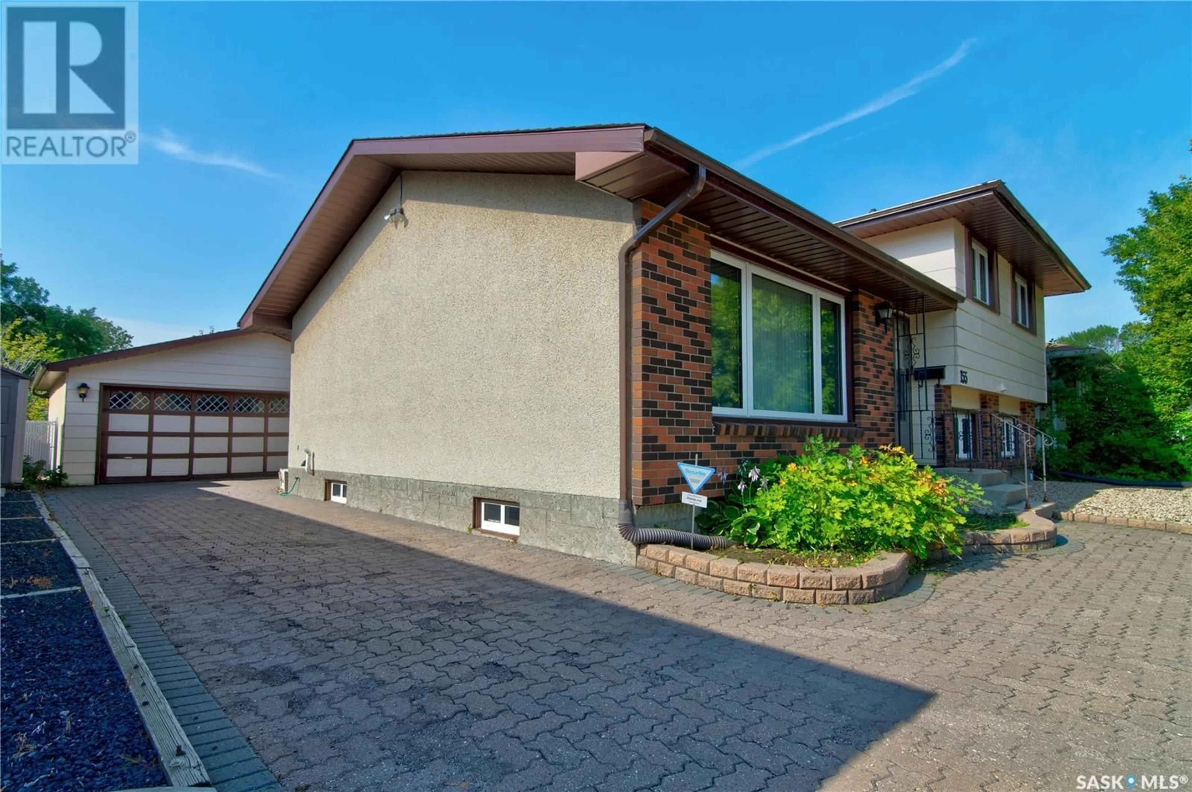 Home with brick exterior material, street for 155 RODENBUSH DRIVE, Regina Saskatchewan S4R7X8