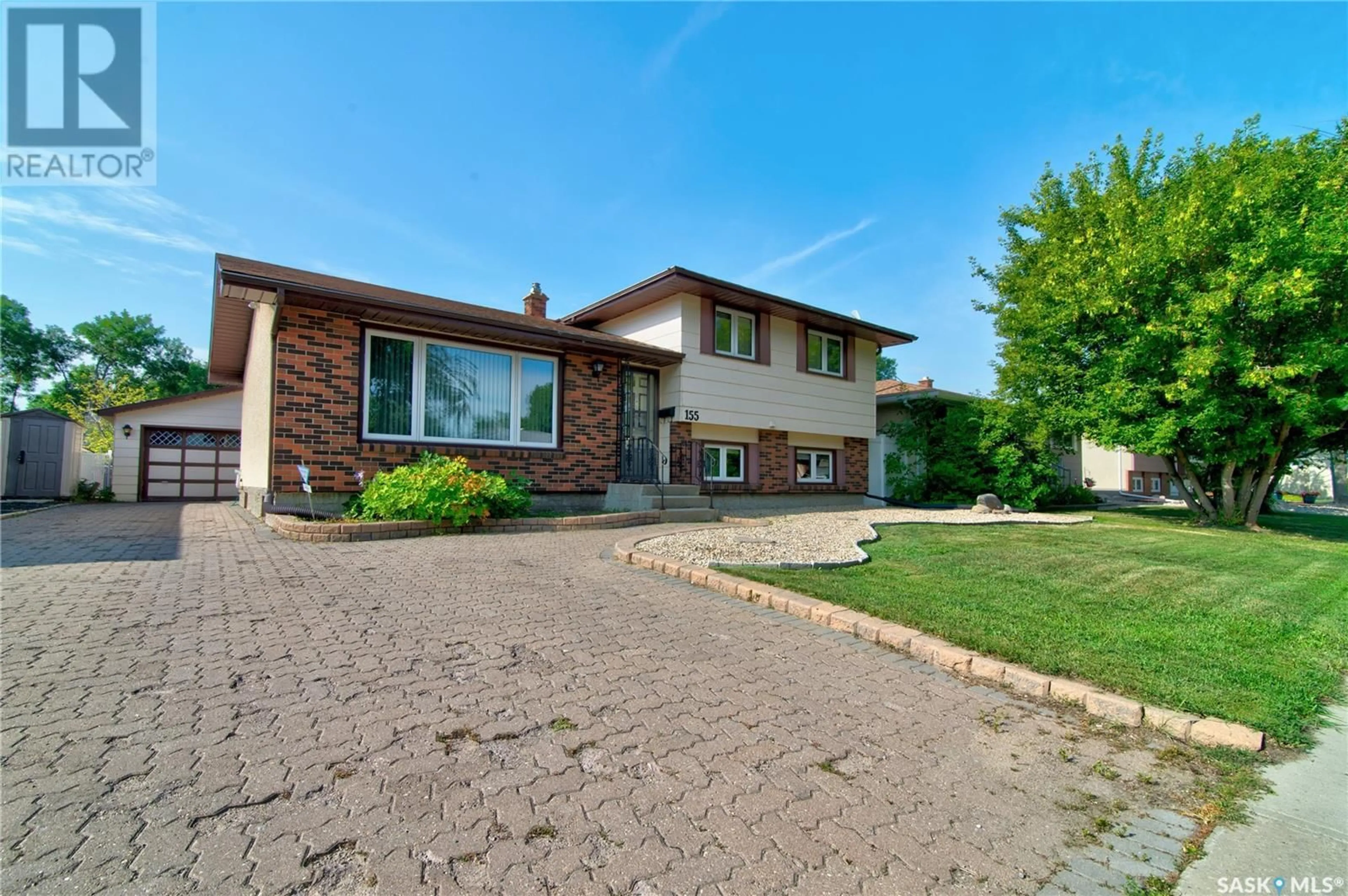 Home with brick exterior material, street for 155 RODENBUSH DRIVE, Regina Saskatchewan S4R7X8