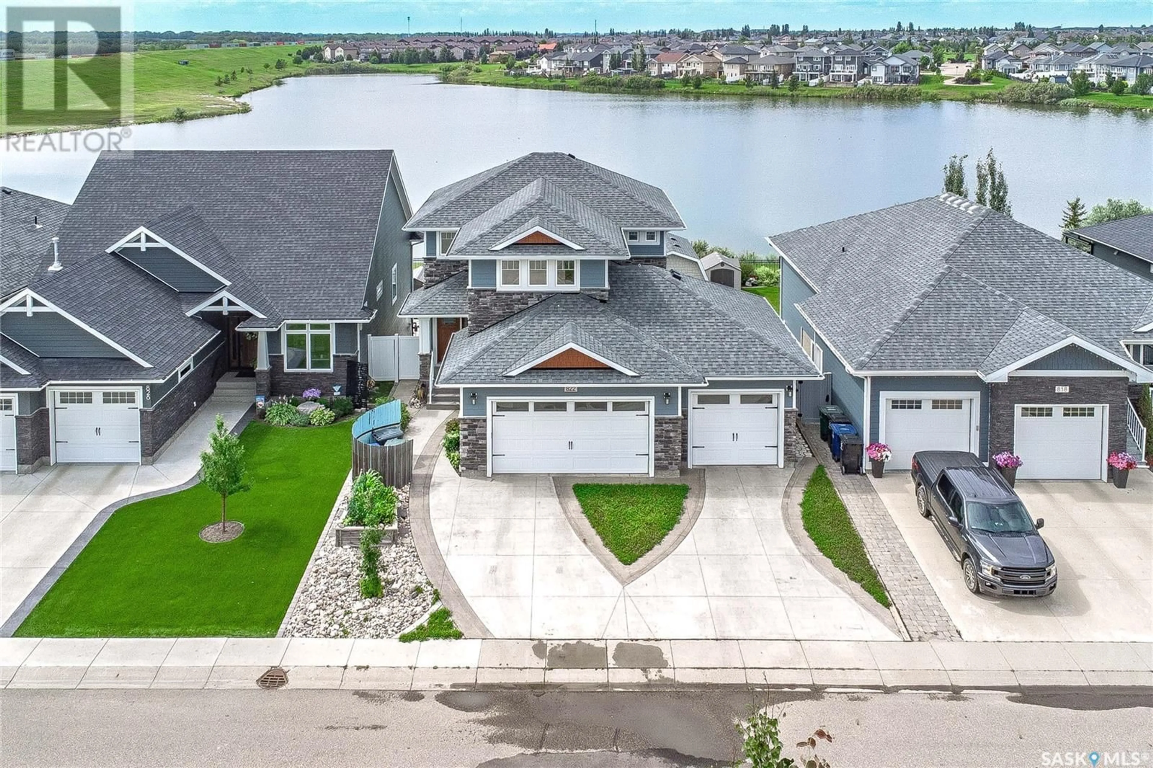 A pic from outside/outdoor area/front of a property/back of a property/a pic from drone, water/lake/river/ocean view for 822 PRINGLE COVE, Saskatoon Saskatchewan S7T0V3