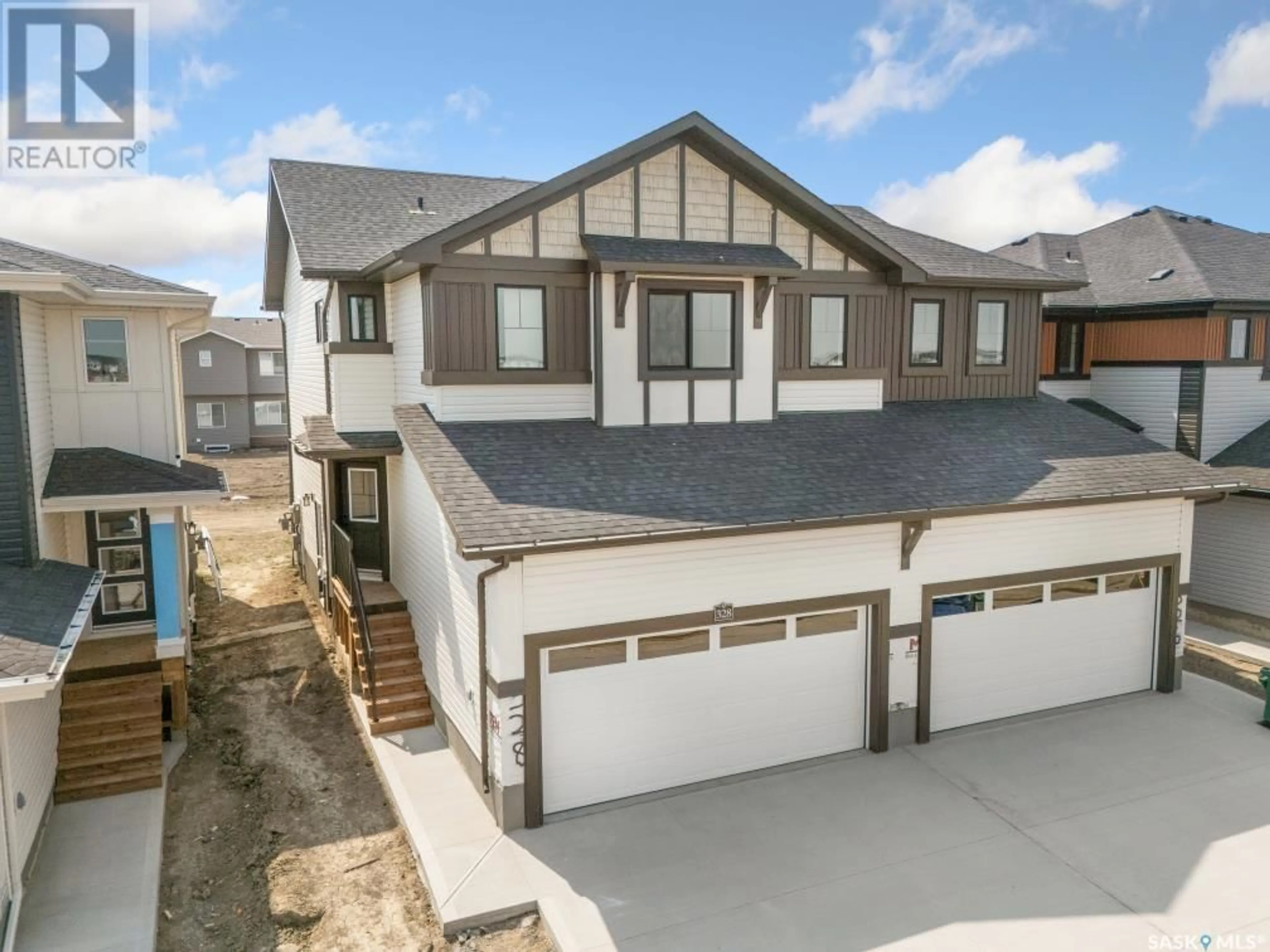 A pic from outside/outdoor area/front of a property/back of a property/a pic from drone, street for 328 MYLES HEIDT LANE, Saskatoon Saskatchewan S7W1J3