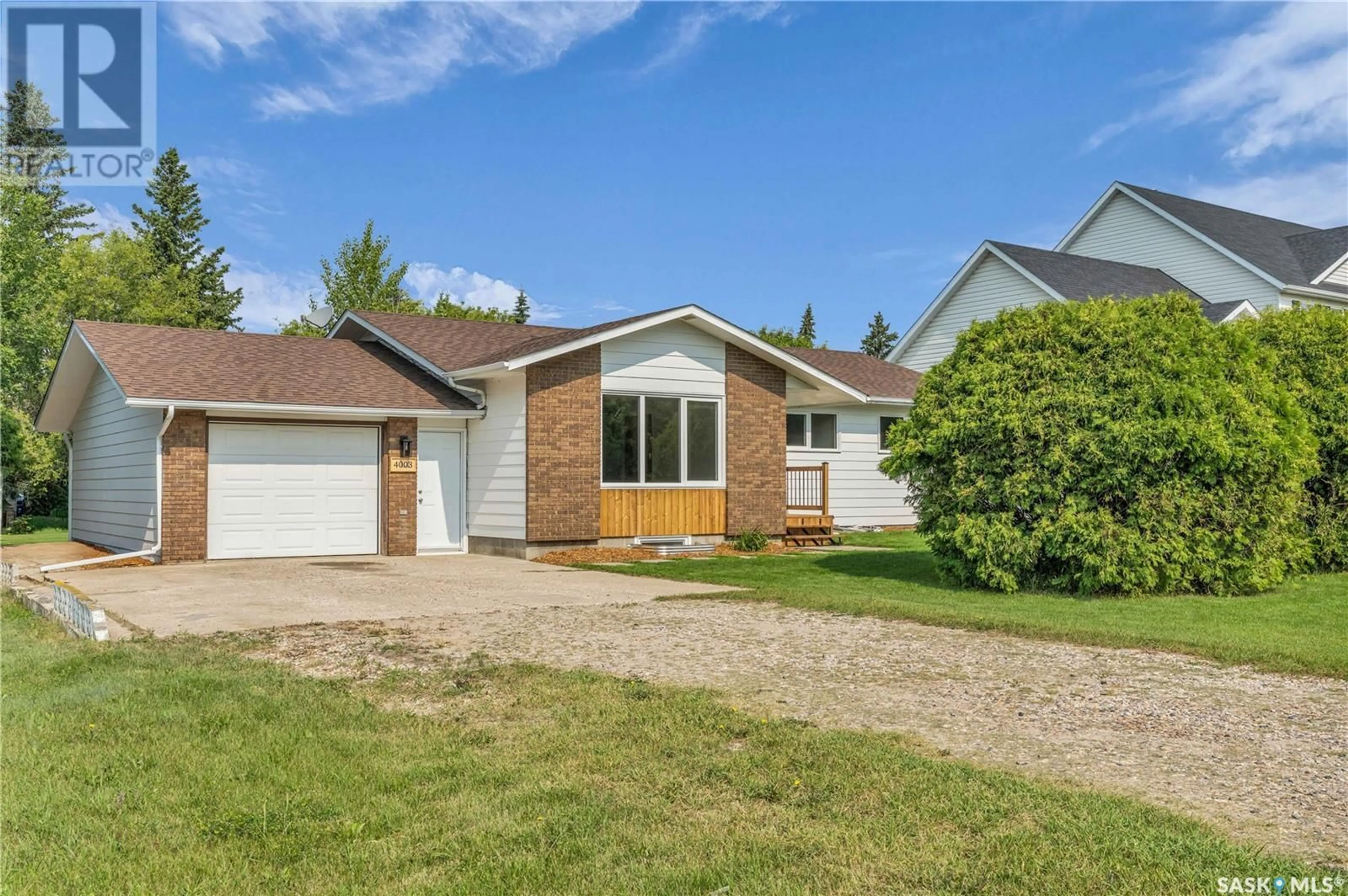Home with vinyl exterior material, street for 4003 NEUFELD AVENUE, Waldheim Saskatchewan S0K4R0