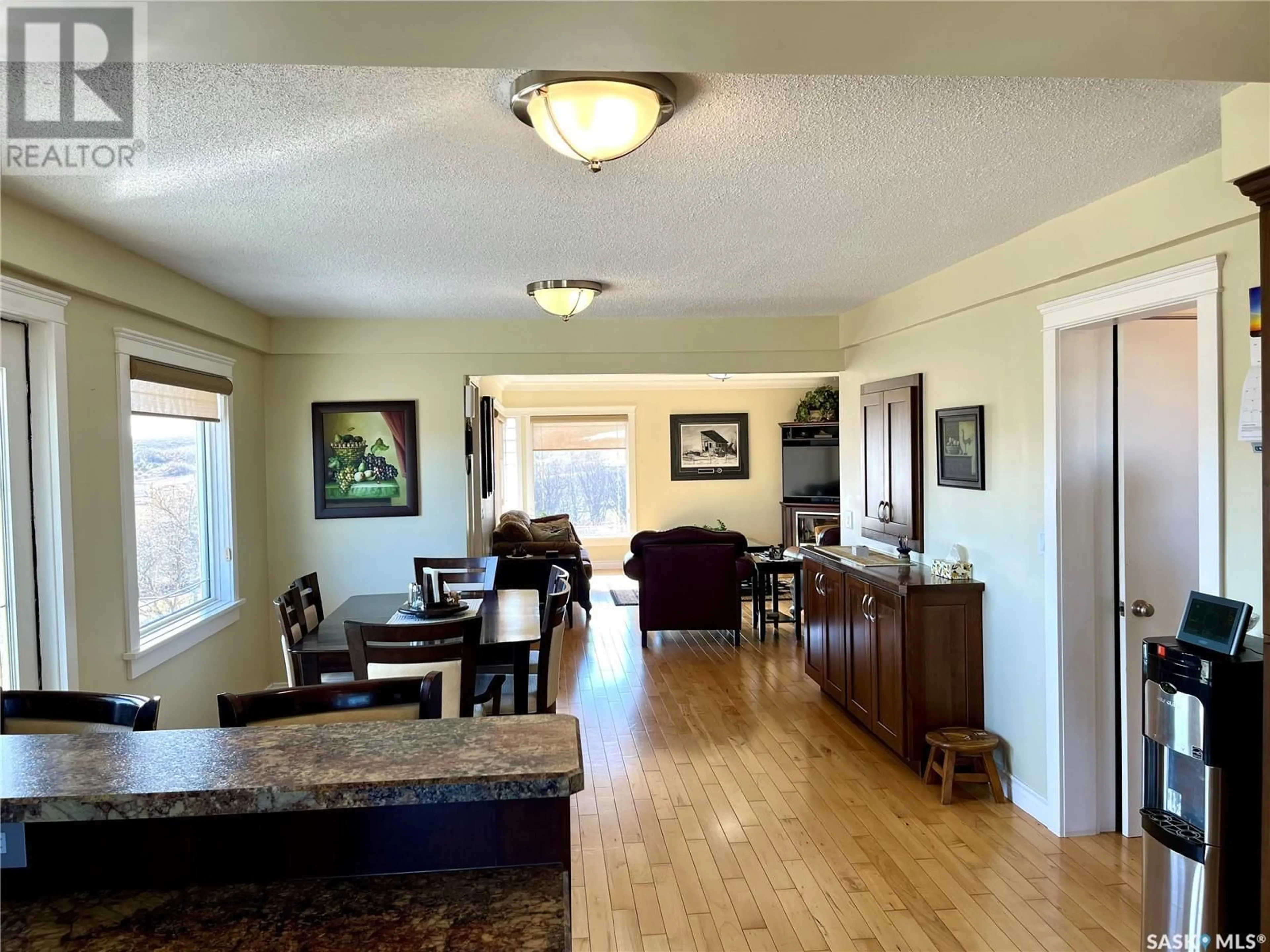 Living room with furniture, wood/laminate floor for CADRAIN ACRES, Swift Current Rm No. 137 Saskatchewan S9H5K8