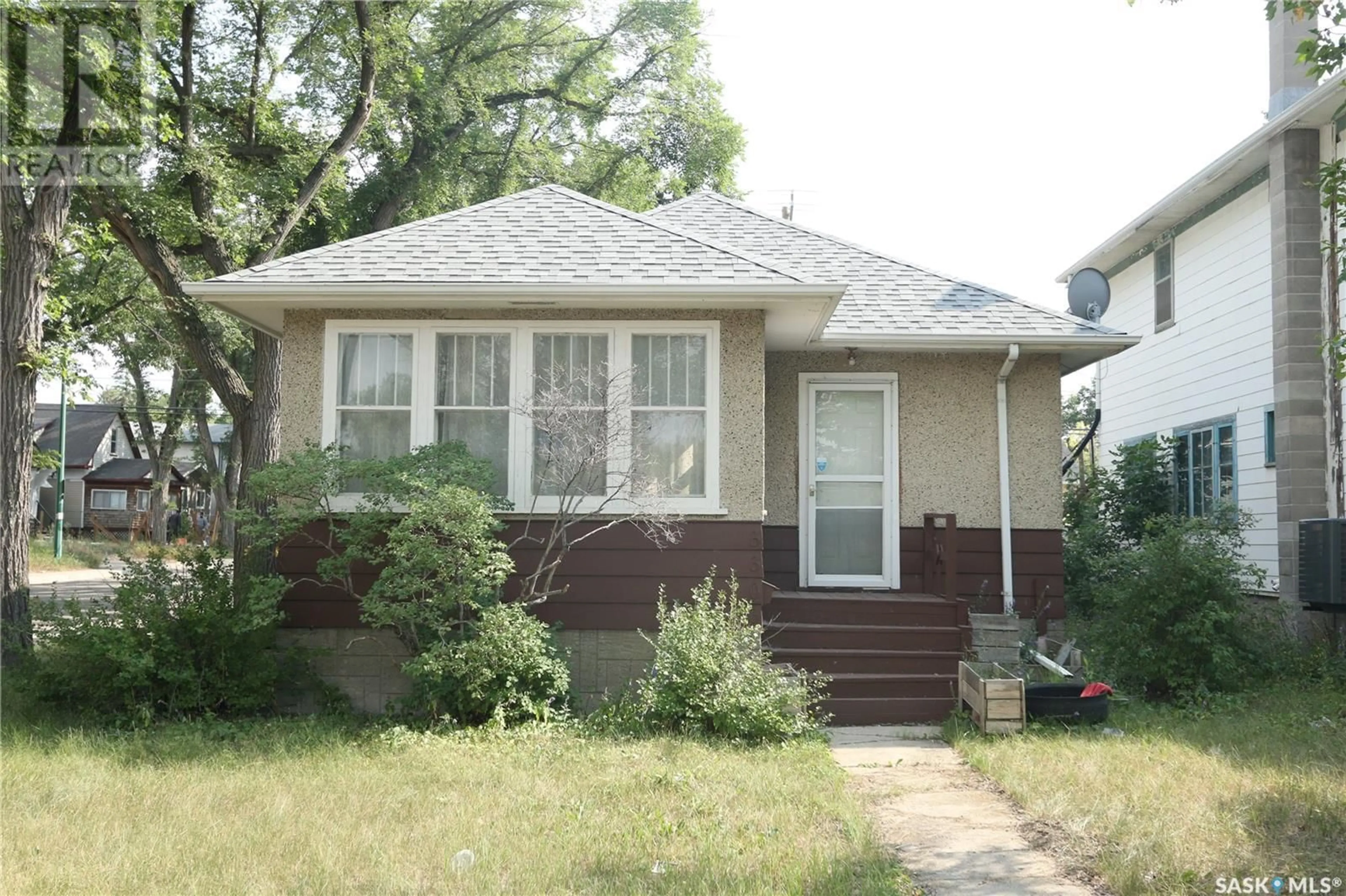 Home with vinyl exterior material, street for 3303 DEWDNEY AVENUE, Regina Saskatchewan S4T0Y9