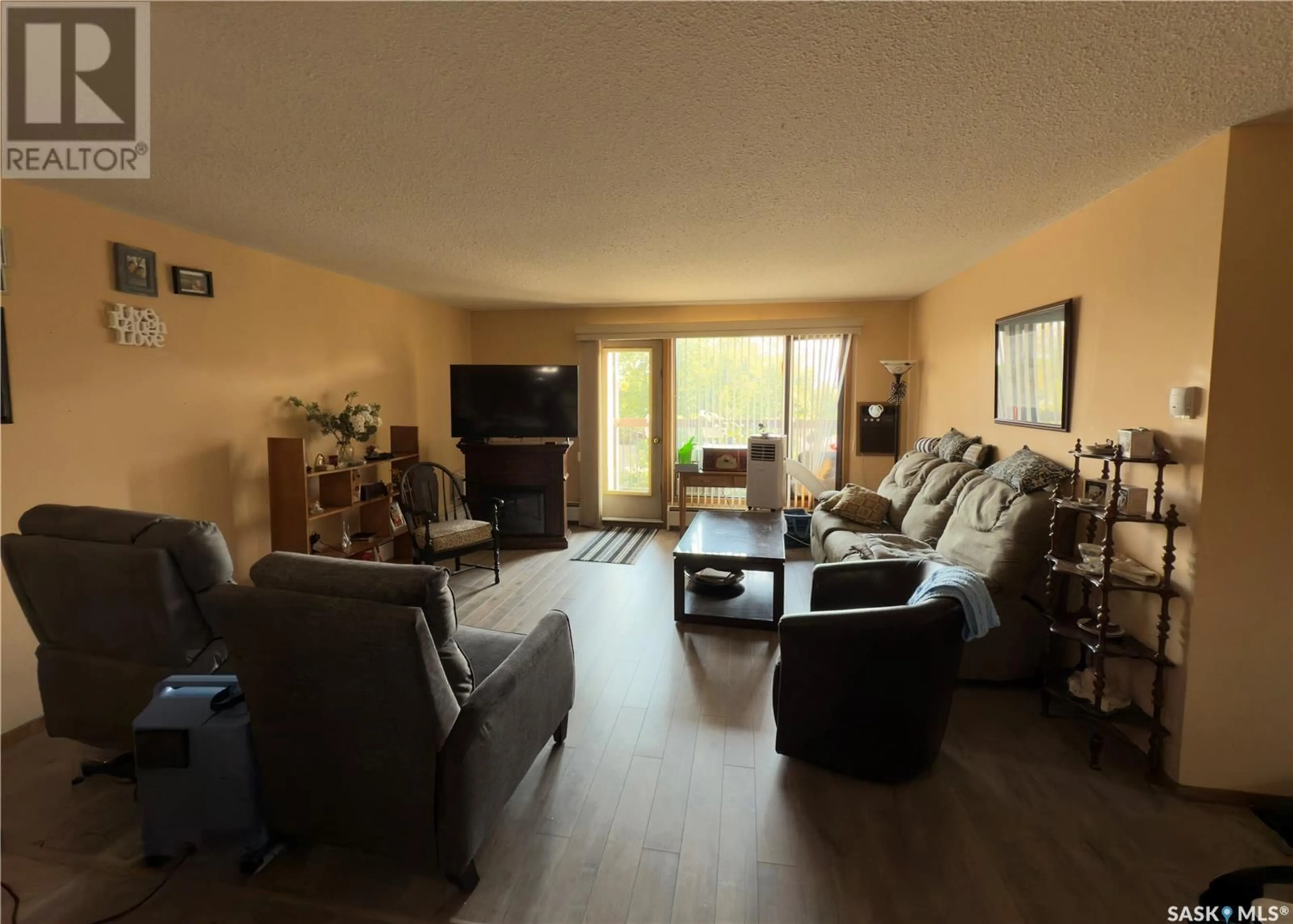 Living room with furniture, wood/laminate floor for E - 303 255 7TH STREET, Prince Albert Saskatchewan S6V0R9