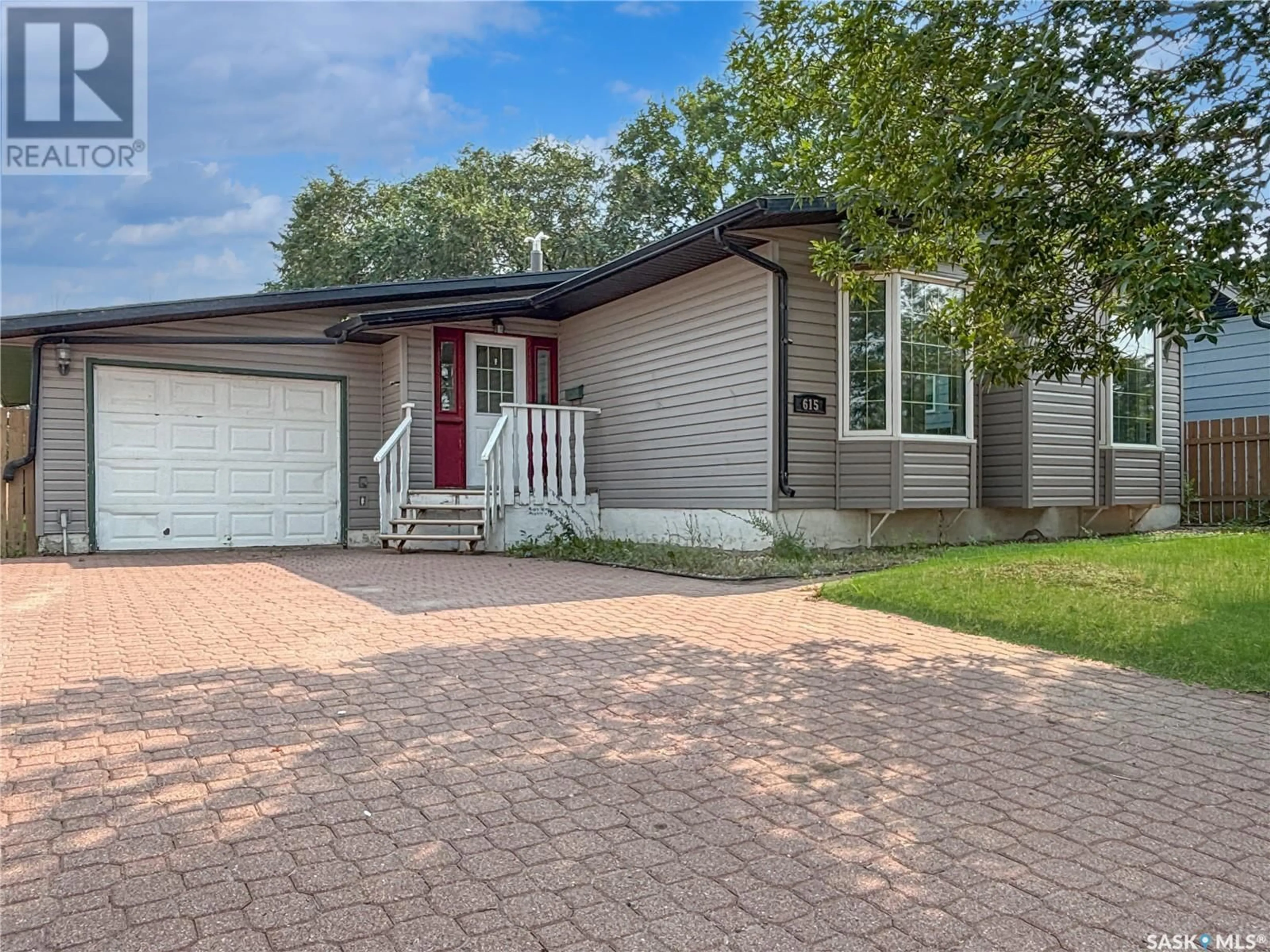 Home with vinyl exterior material, street for 615 LENORE DRIVE, Saskatoon Saskatchewan S7K5G7