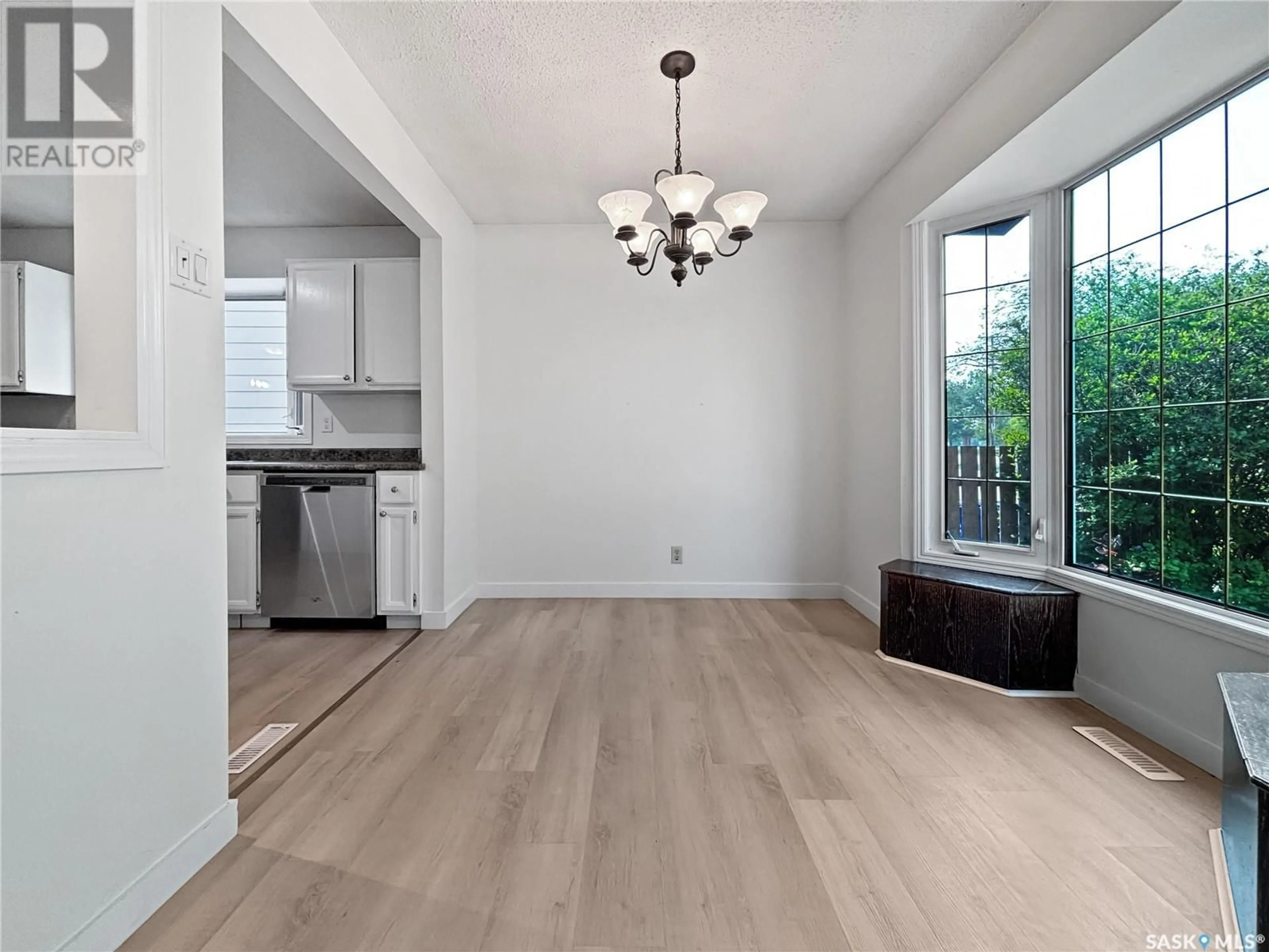 Open concept kitchen, wood/laminate floor for 615 LENORE DRIVE, Saskatoon Saskatchewan S7K5G7