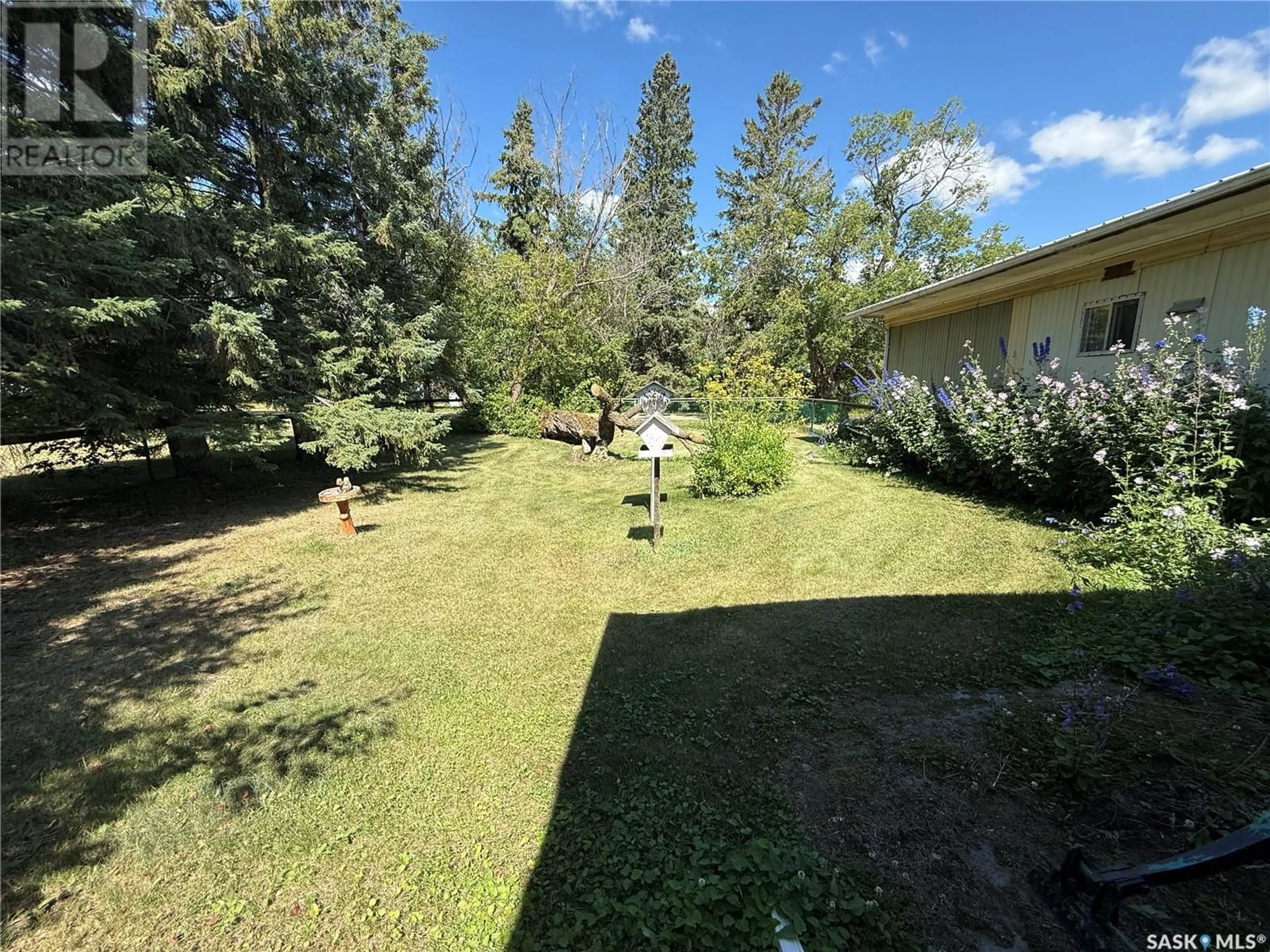 A pic from outside/outdoor area/front of a property/back of a property/a pic from drone, forest/trees view for 102 1ST AVENUE, Parkside Saskatchewan S0J2A0