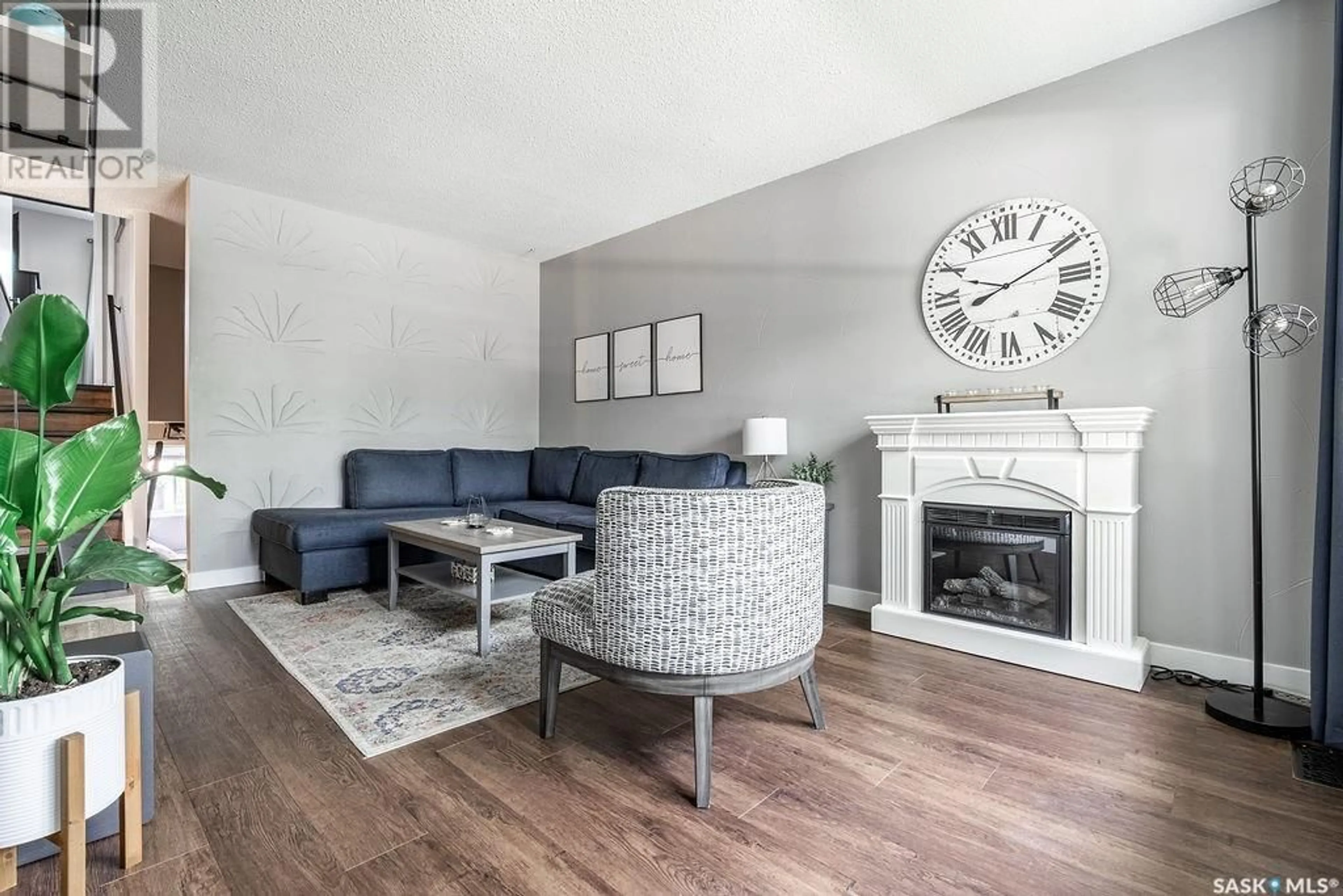 Living room with furniture, wood/laminate floor for 433 EAST PLACE, Saskatoon Saskatchewan S7J2Y7