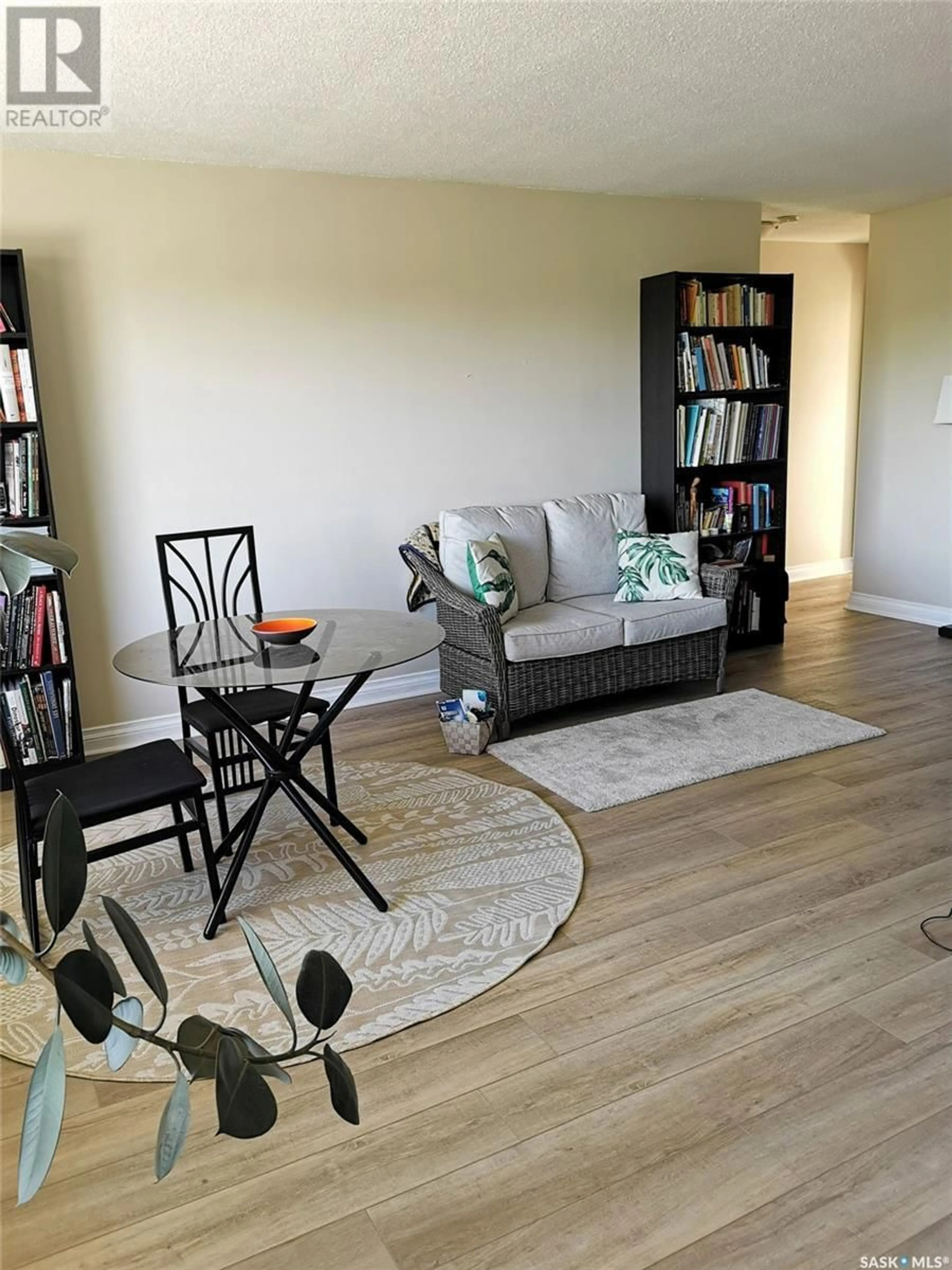Living room with furniture, wood/laminate floor for 18 - 1811 8TH AVENUE N, Regina Saskatchewan S4R0G5